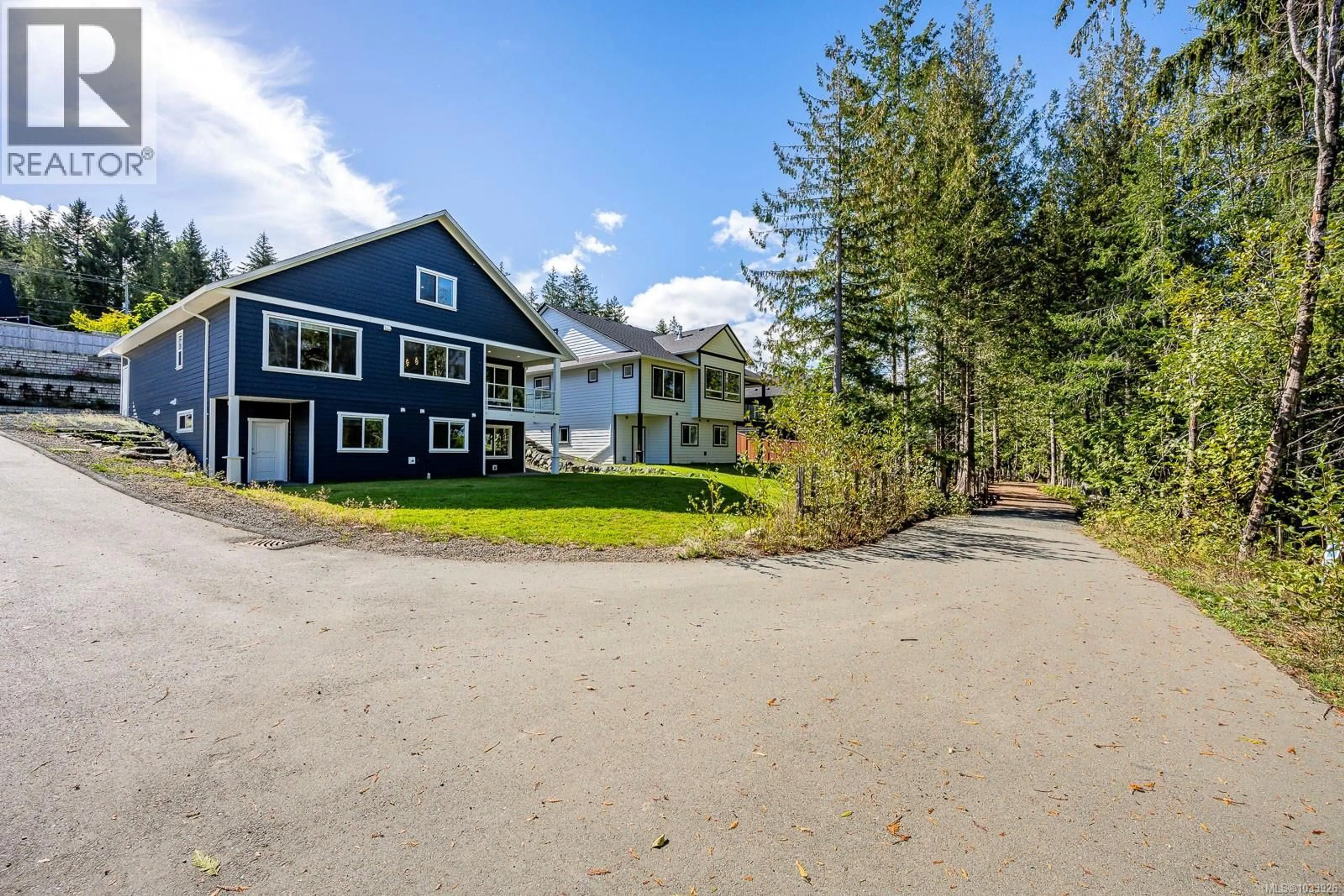 A pic from outside/outdoor area/front of a property/back of a property/a pic from drone, unknown for 3240 KLANAWA CRESCENT, Courtenay British Columbia V9N0H4
