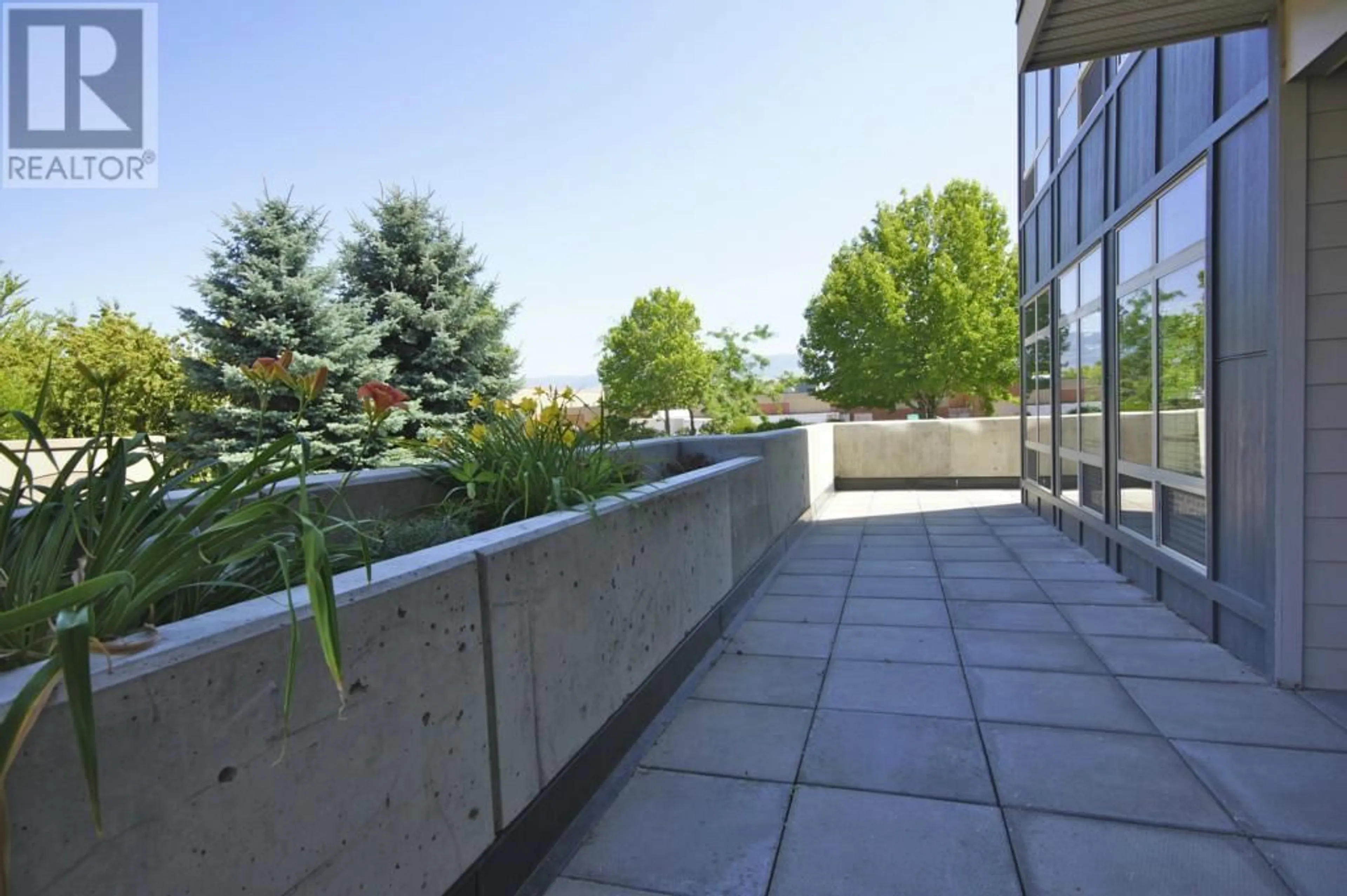 Patio, city buildings view from balcony for 112 - 2142 VASILE ROAD, Kelowna British Columbia V1Y6H5