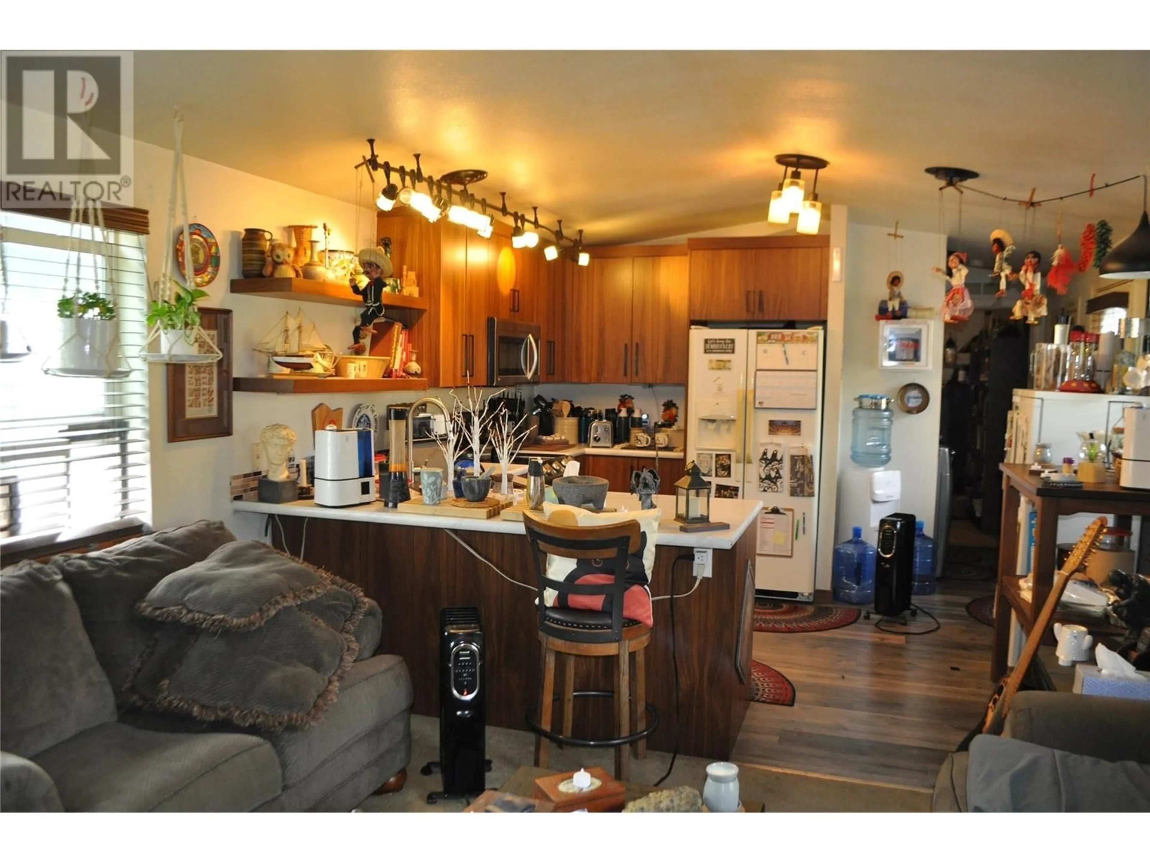 Open concept kitchen, wood/laminate floor for 42 JOHNSON WAY, Revelstoke British Columbia V0E2S1