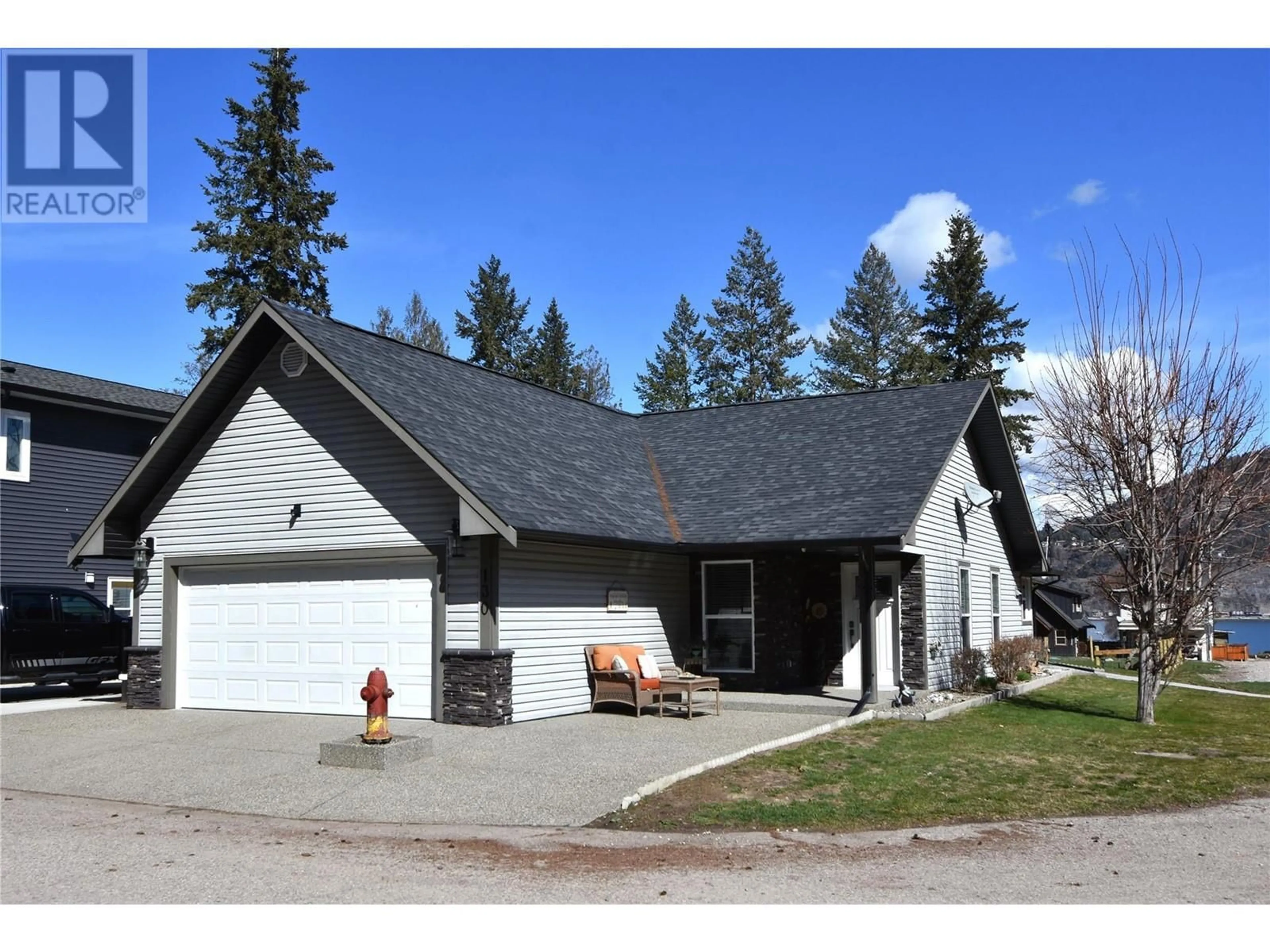 Home with vinyl exterior material, street for 130 Deer Street, Vernon British Columbia V1H2A1