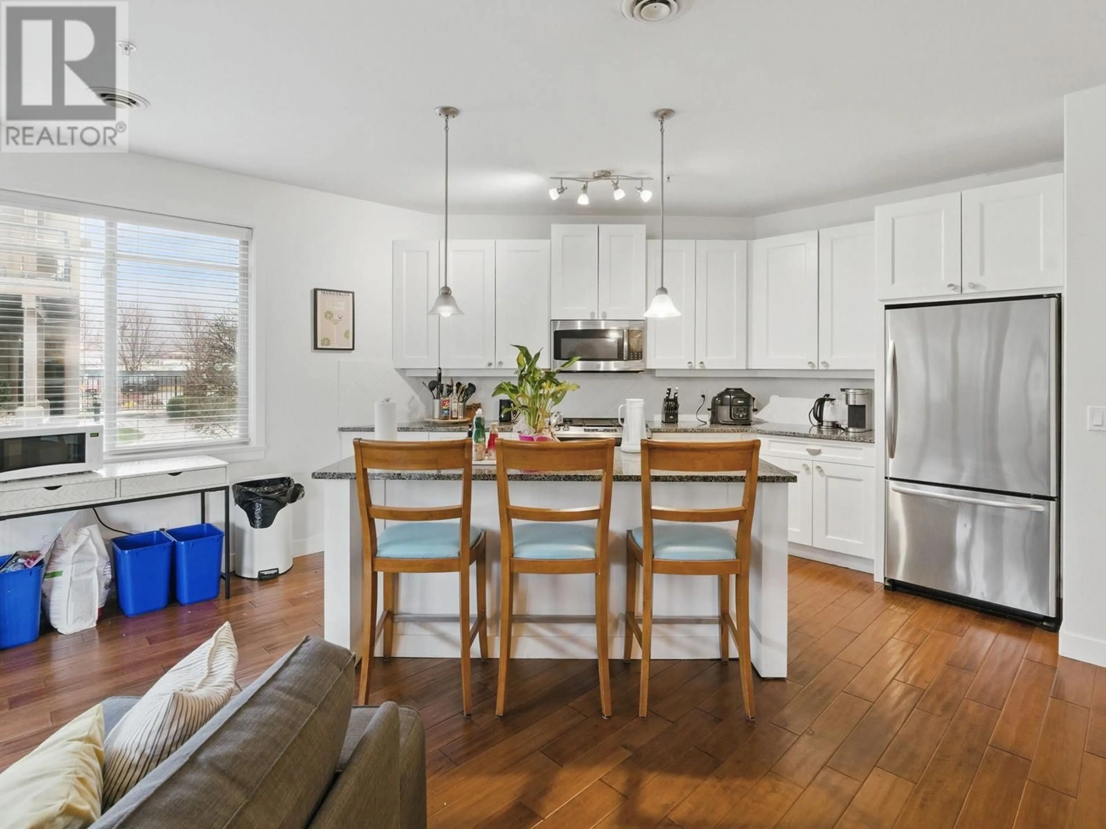 Open concept kitchen, wood/laminate floor for 6104 - 4026 PRITCHARD DRIVE NORTH, West Kelowna British Columbia V4T3E4