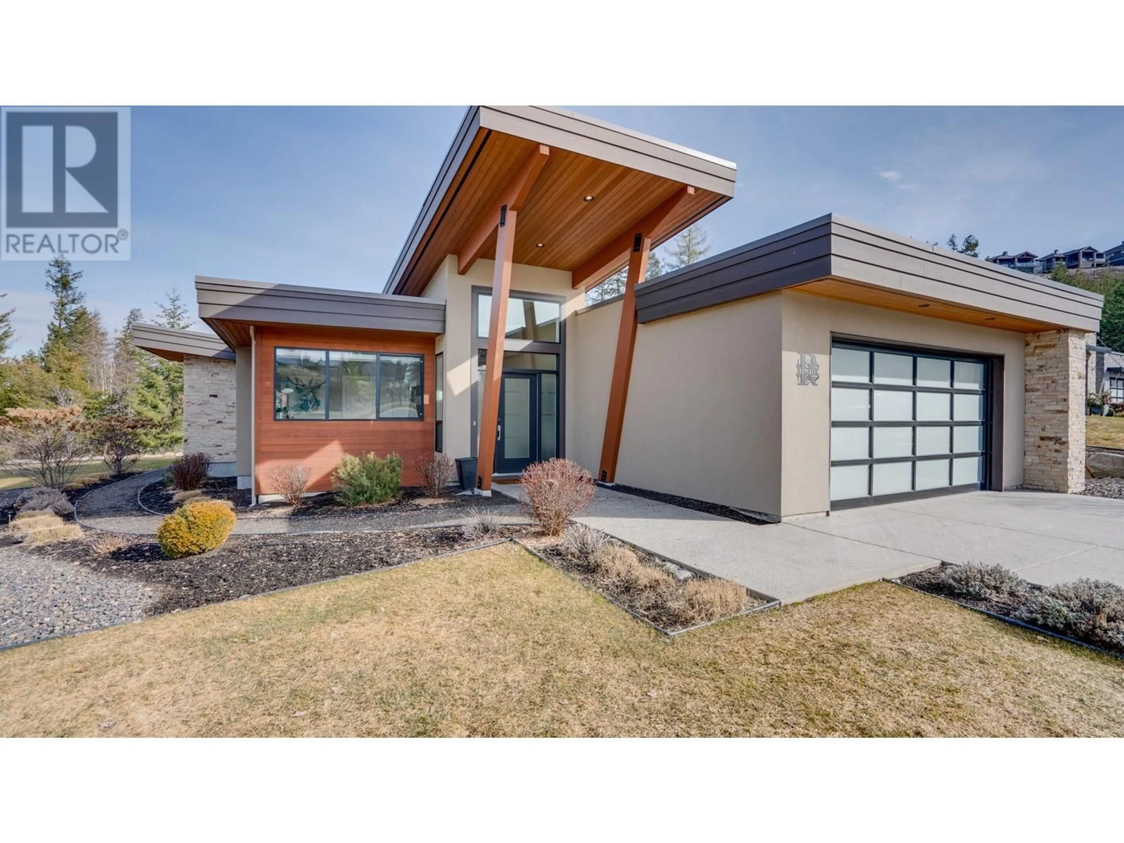 Home with brick exterior material, street for 1 - 450 PREDATOR RIDGE DRIVE, Vernon British Columbia V1H2L7