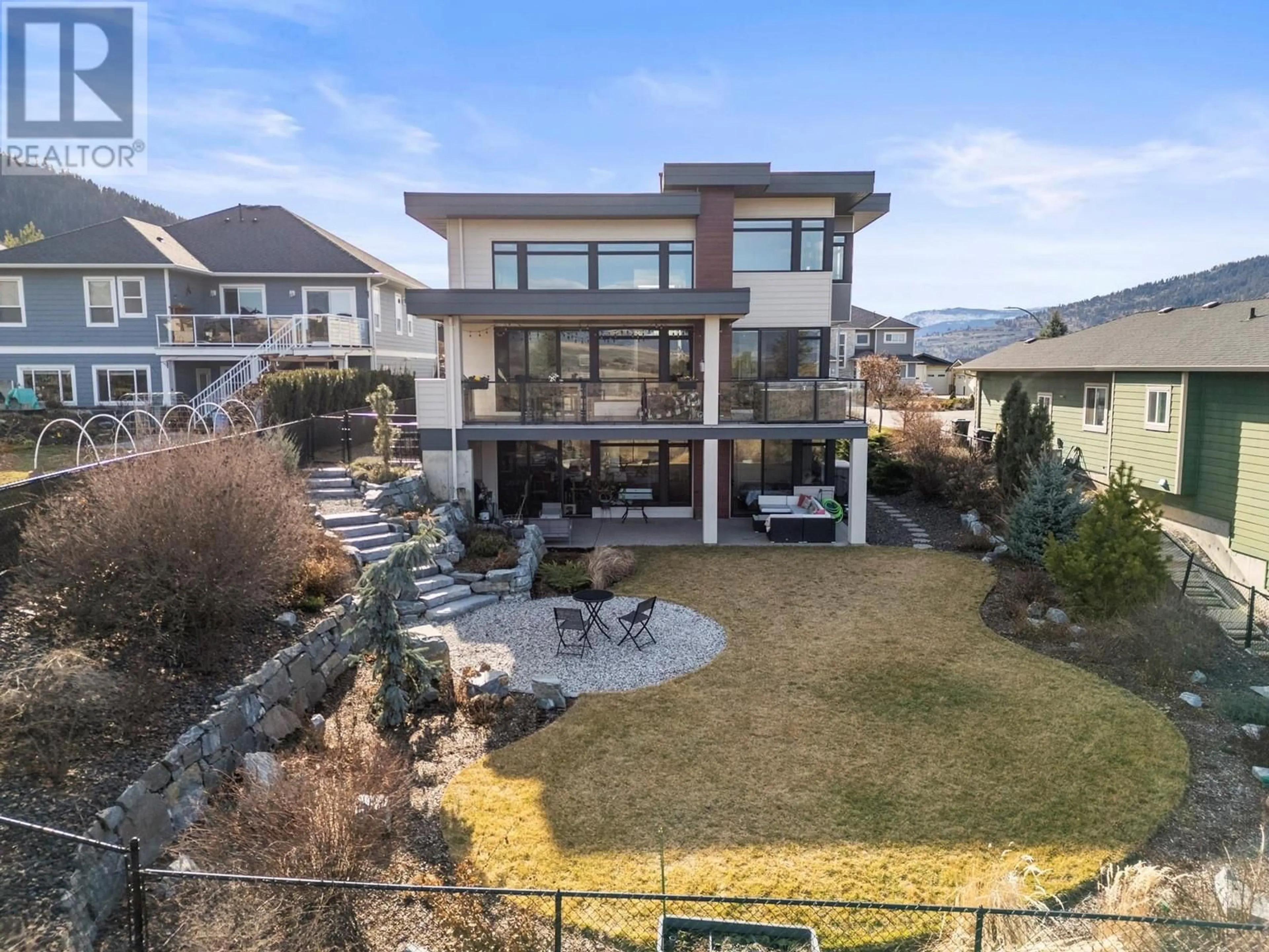 A pic from outside/outdoor area/front of a property/back of a property/a pic from drone, mountain view for 1021 LONGACRE PLACE, Vernon British Columbia V1H1H7