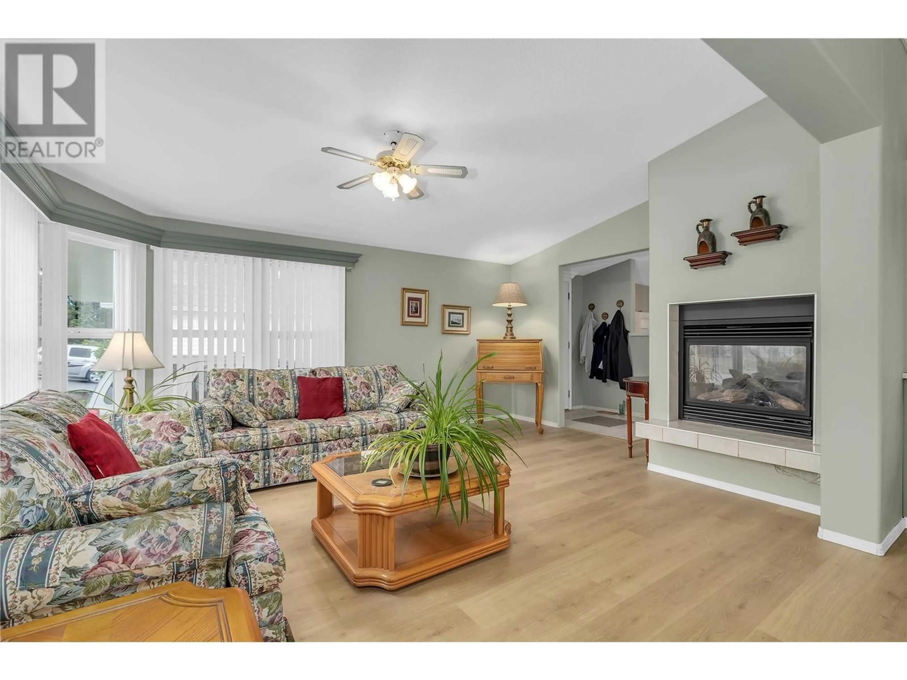 Living room with furniture, wood/laminate floor for 133 - 1850 SHANNON LAKE ROAD, West Kelowna British Columbia v4t1l6