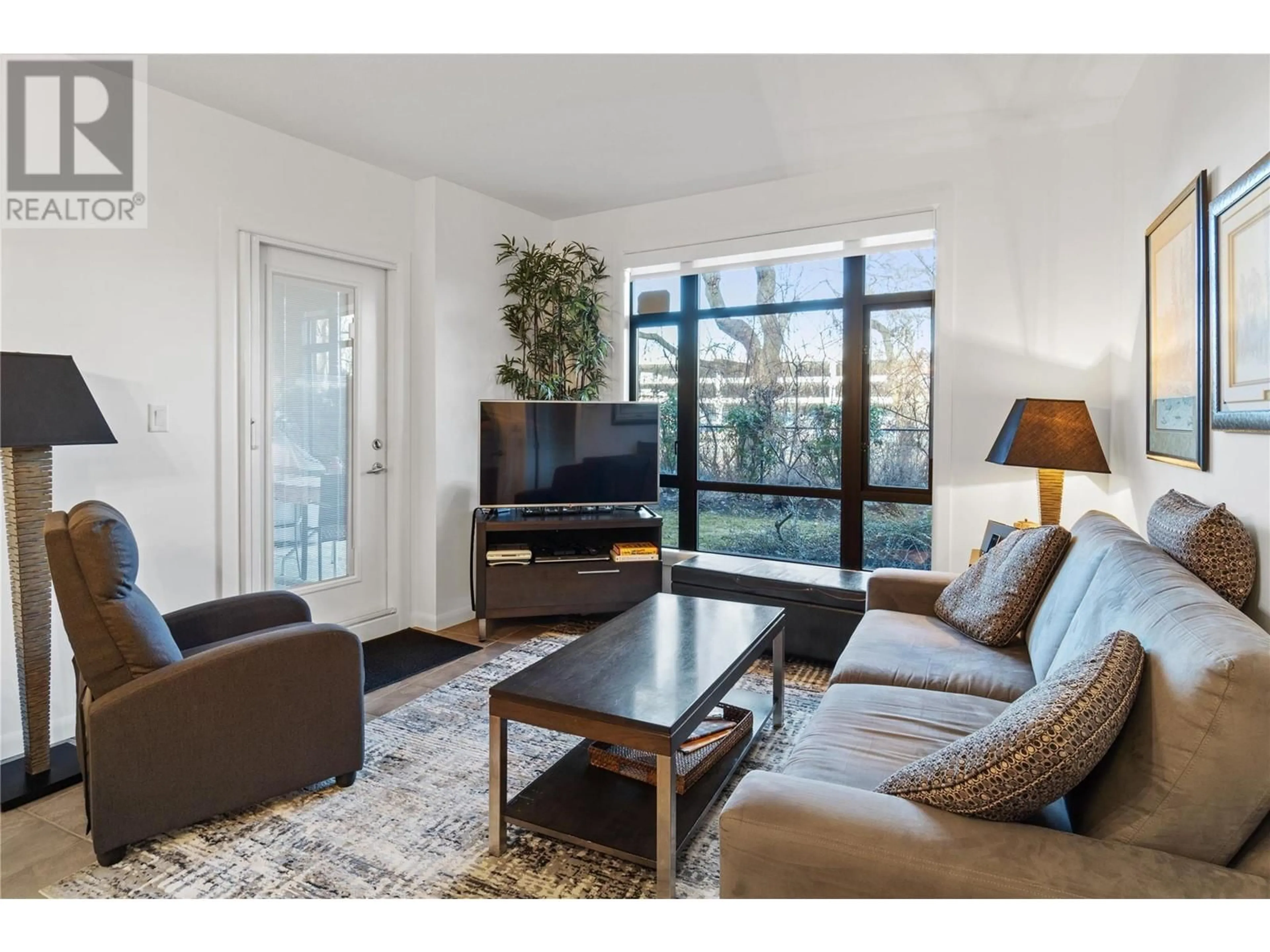 Living room with furniture, wood/laminate floor for 142 - 654 COOK ROAD, Kelowna British Columbia V1W3G7