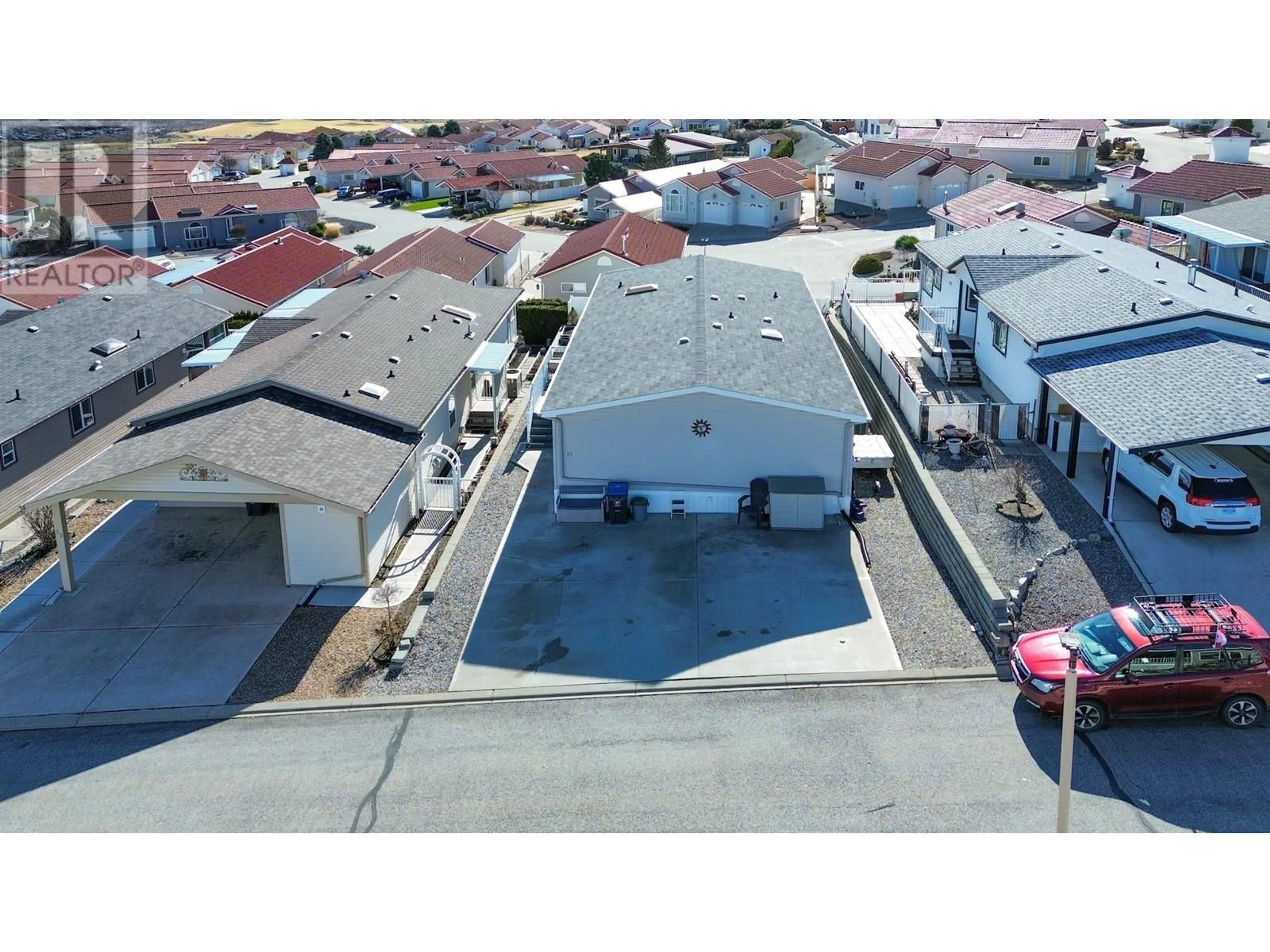 A pic from outside/outdoor area/front of a property/back of a property/a pic from drone, street for 22 - 9410 115TH STREET, Osoyoos British Columbia V0H1V5