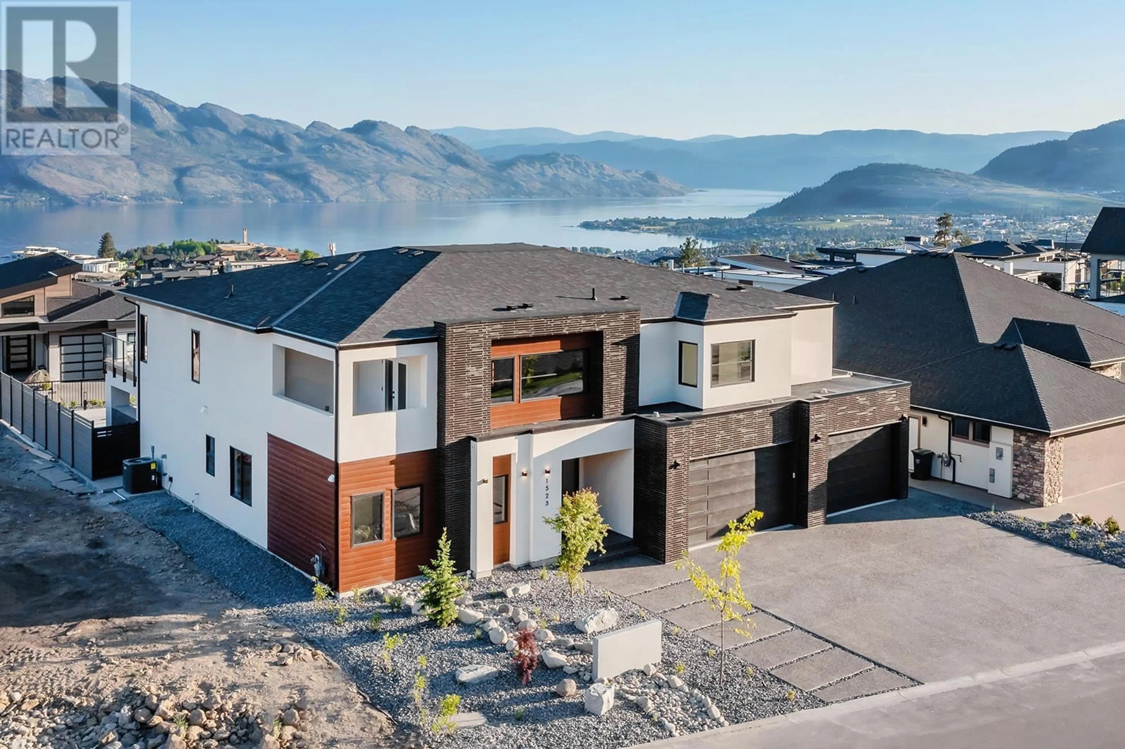 Home with brick exterior material, mountain view for 1523 CABERNET WAY, Kelowna British Columbia V4T0E1