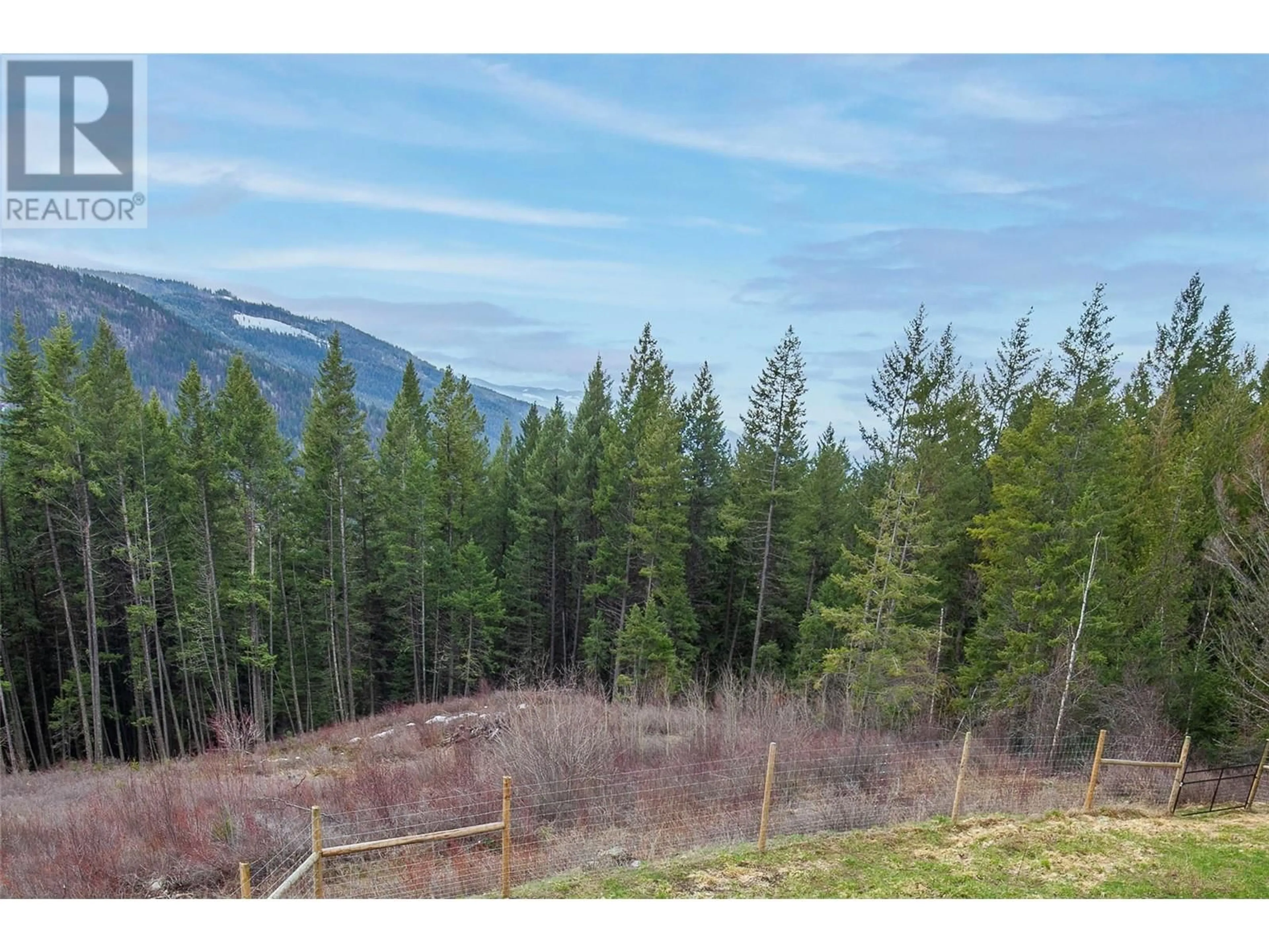 A pic from outside/outdoor area/front of a property/back of a property/a pic from drone, forest/trees view for 8022 ASPEN ROAD, Vernon British Columbia V1B3M9