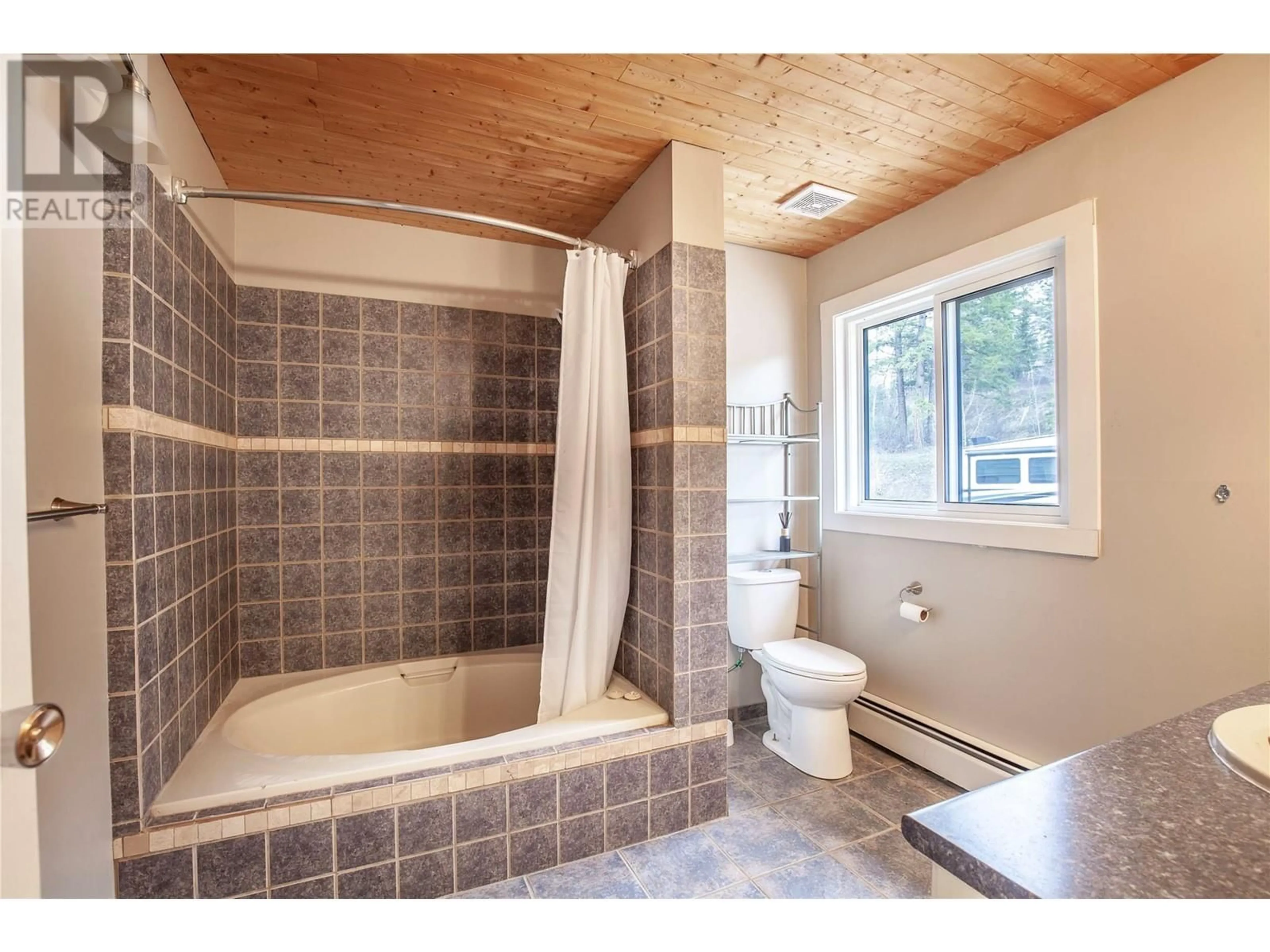 Standard bathroom, ceramic/tile floor for 8022 ASPEN ROAD, Vernon British Columbia V1B3M9