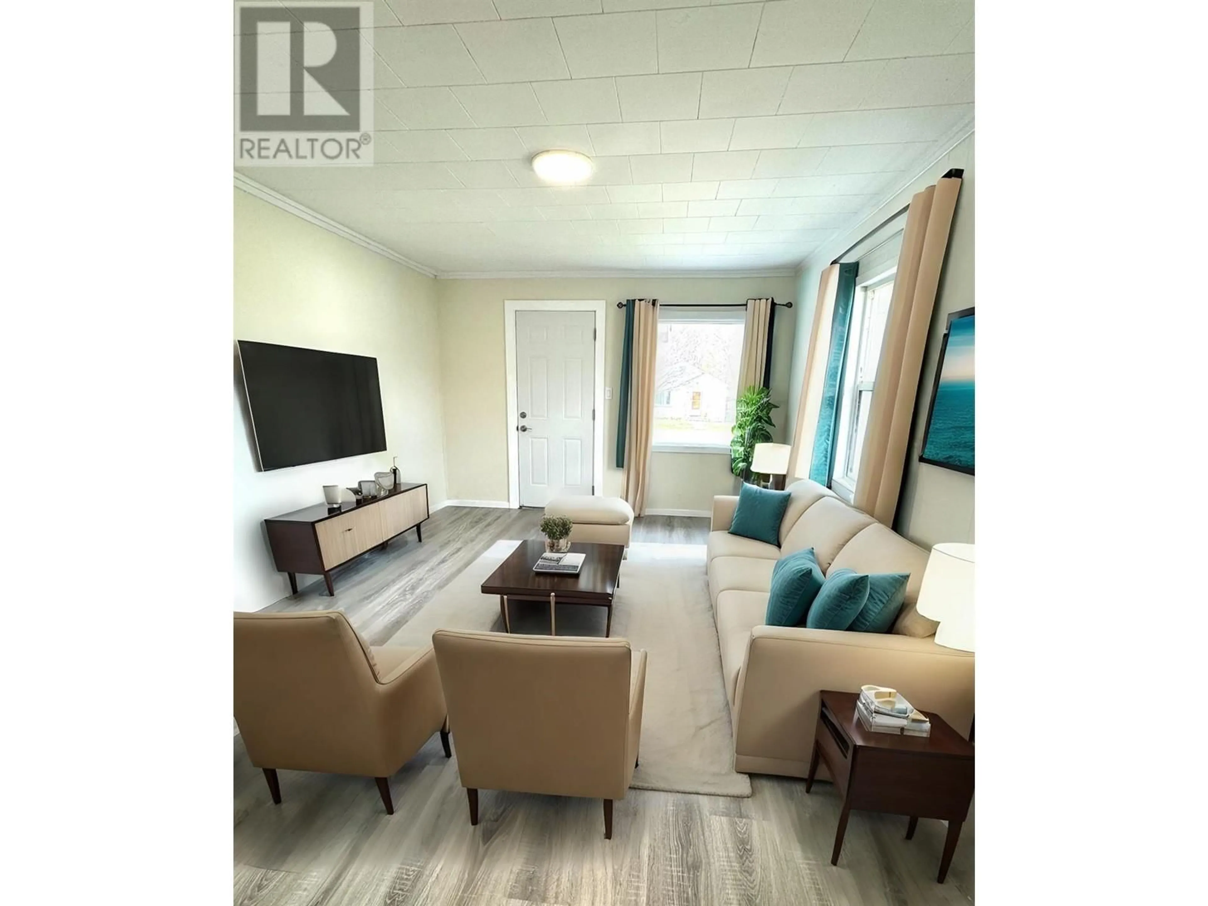 Living room with furniture, wood/laminate floor for 1021 WILLOW STREET, Okanagan Falls British Columbia V0H1R4