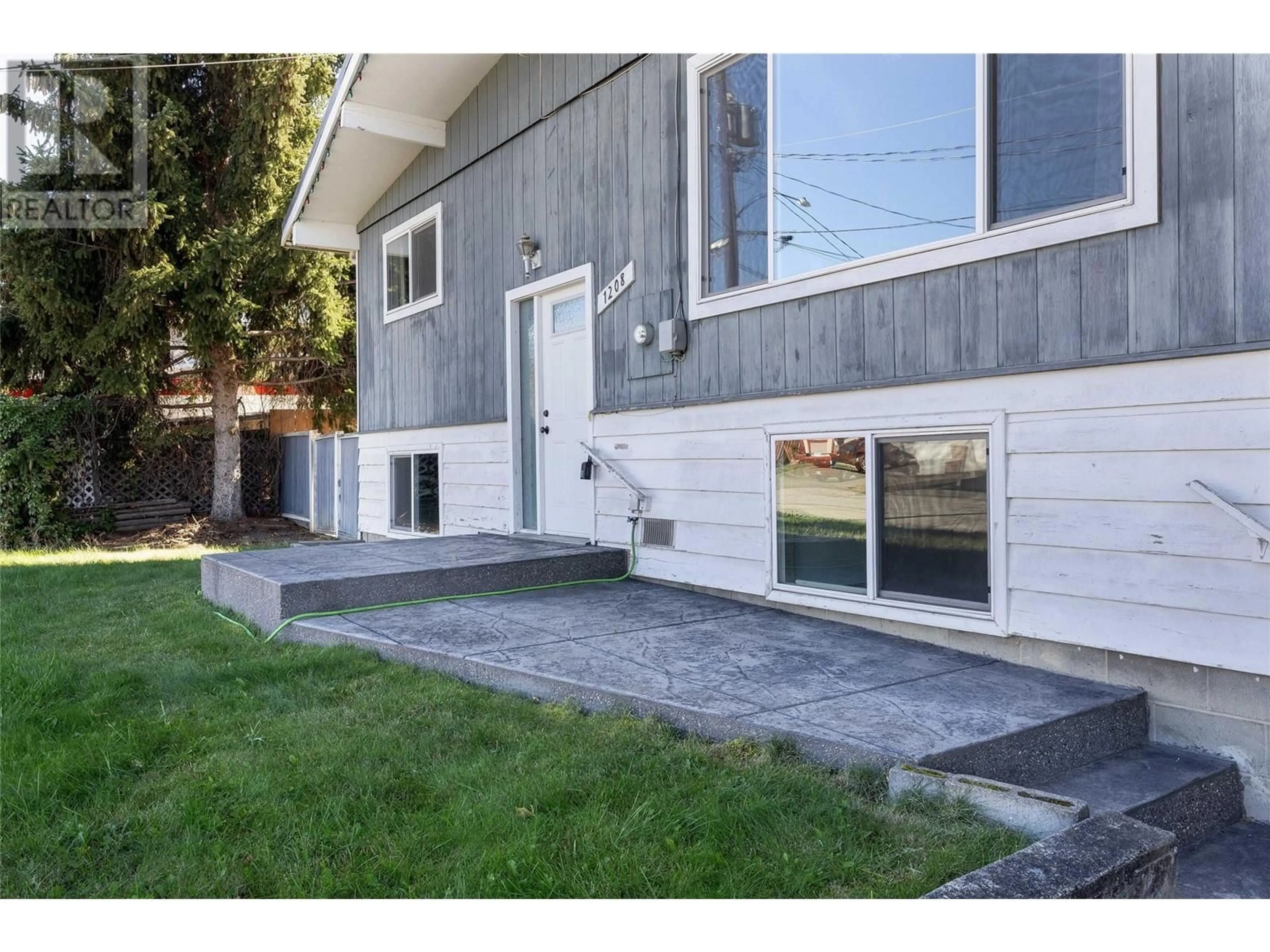 Home with vinyl exterior material, street for 1208 38 AVENUE, Vernon British Columbia V1T2Y7
