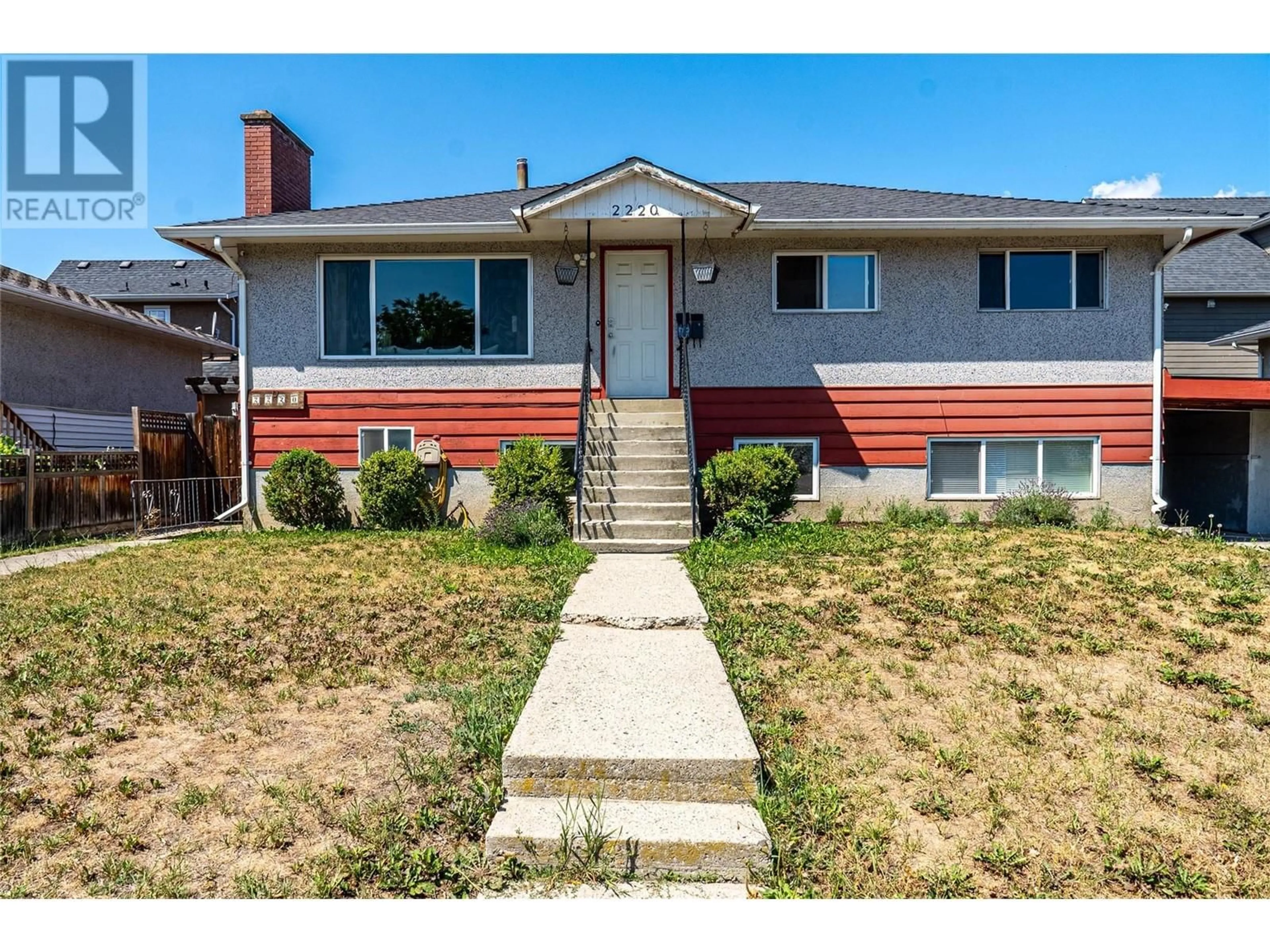 Home with vinyl exterior material, street for 2220 BURNETT STREET, Kelowna British Columbia V1Y2T6