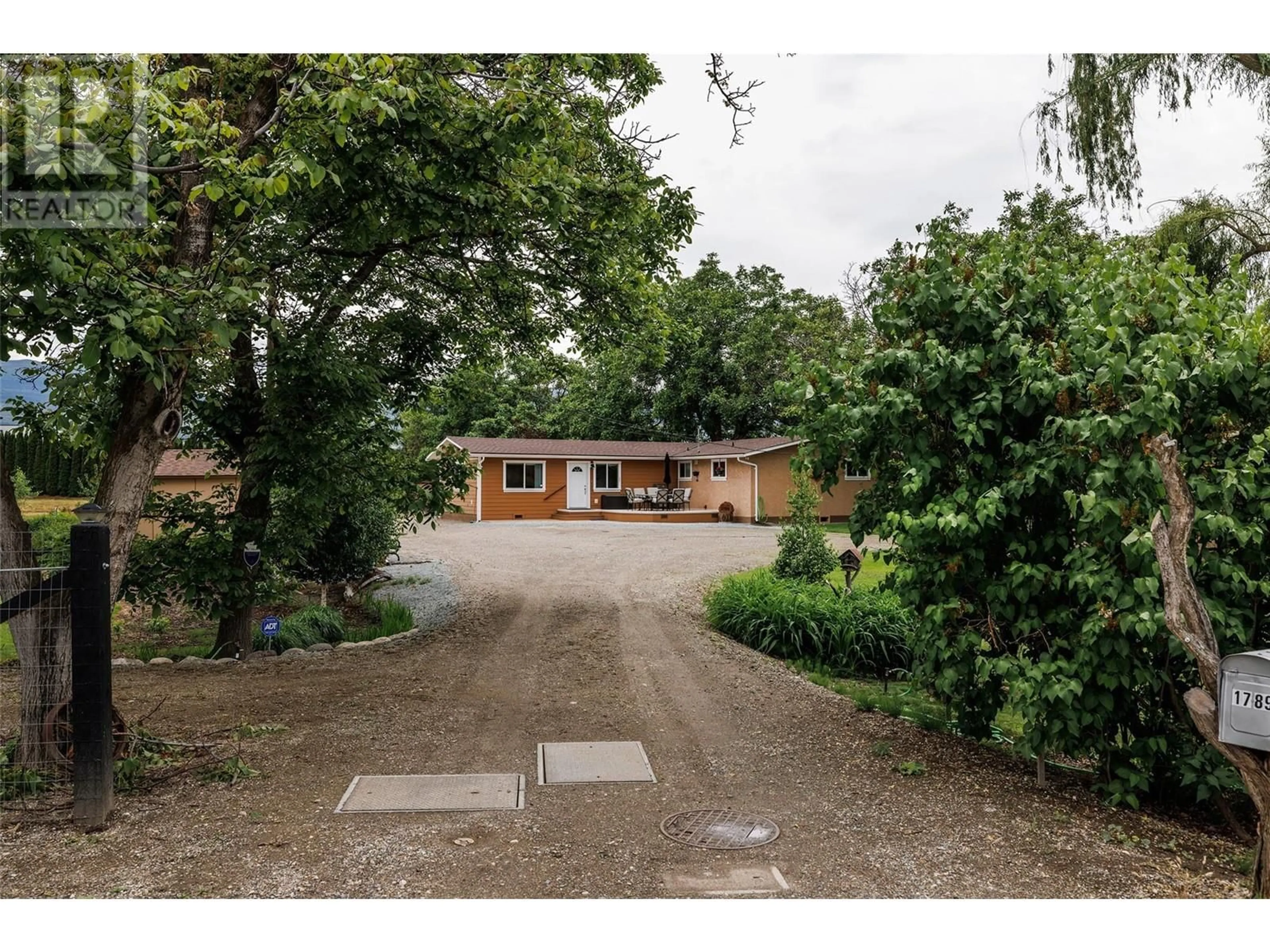 A pic from outside/outdoor area/front of a property/back of a property/a pic from drone, street for 1789 MUNSON ROAD, Kelowna British Columbia V1W2G8