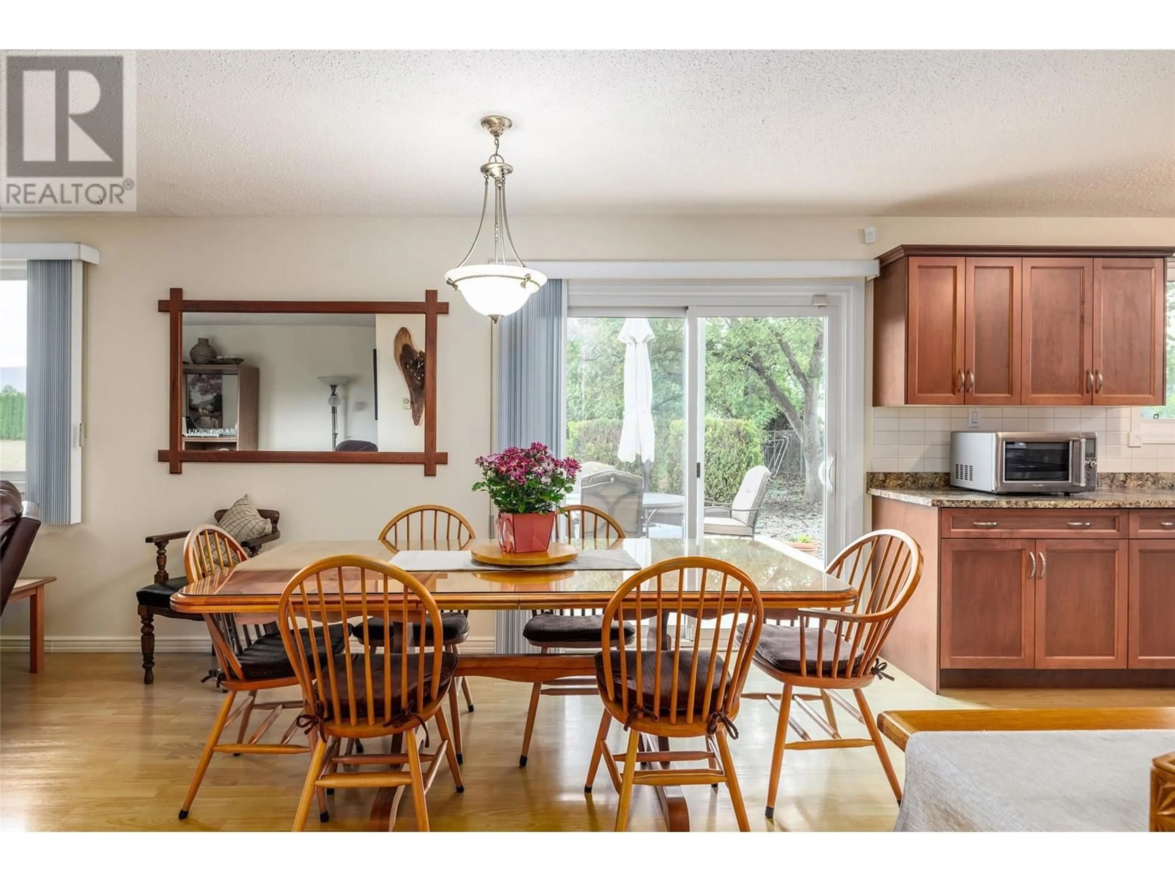 Dining room, wood/laminate floor for 1789 MUNSON ROAD, Kelowna British Columbia V1W2G8