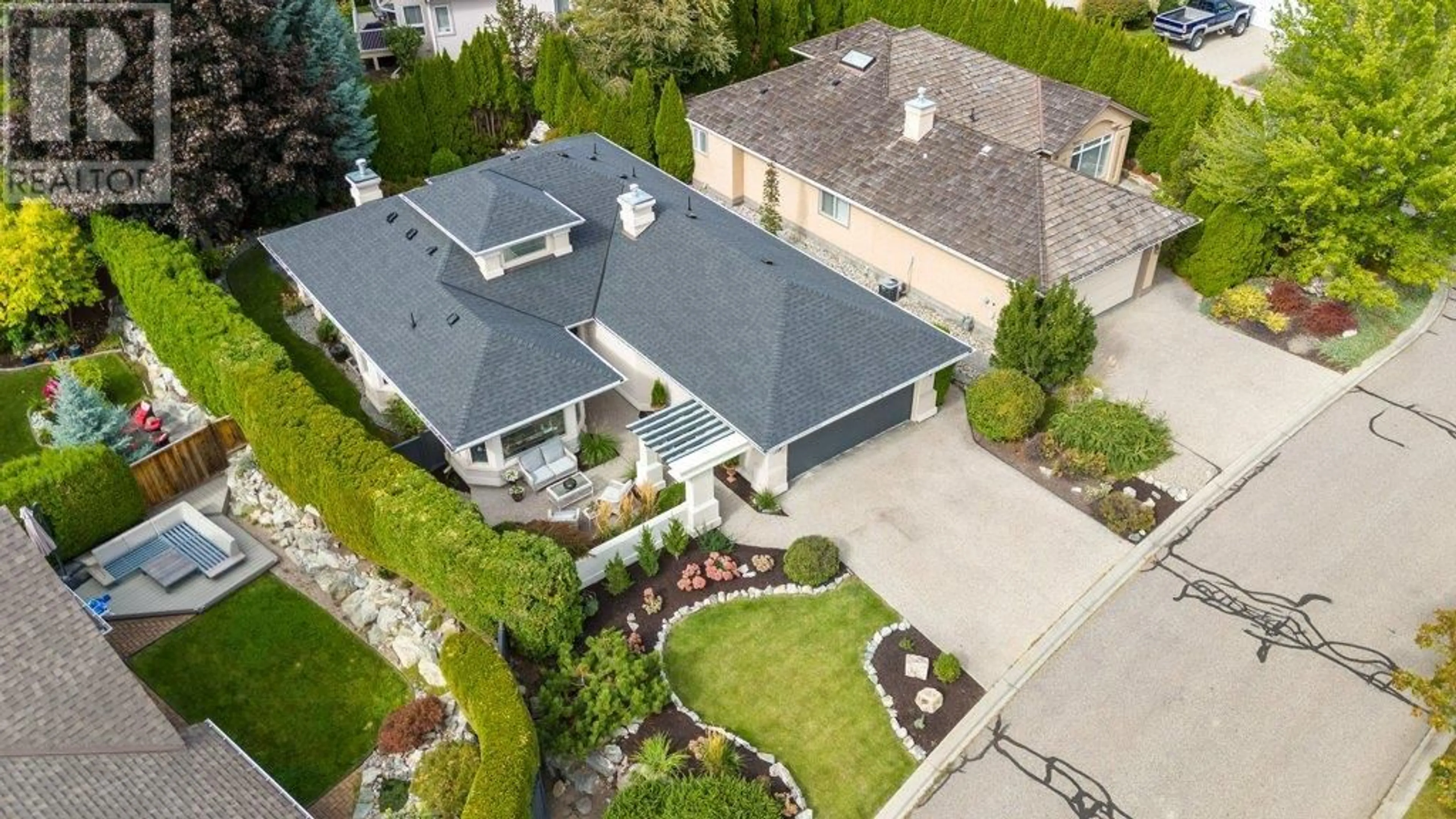 A pic from outside/outdoor area/front of a property/back of a property/a pic from drone, street for 4222 GALLAGHERS CRESCENT, Kelowna British Columbia V1W3Z9