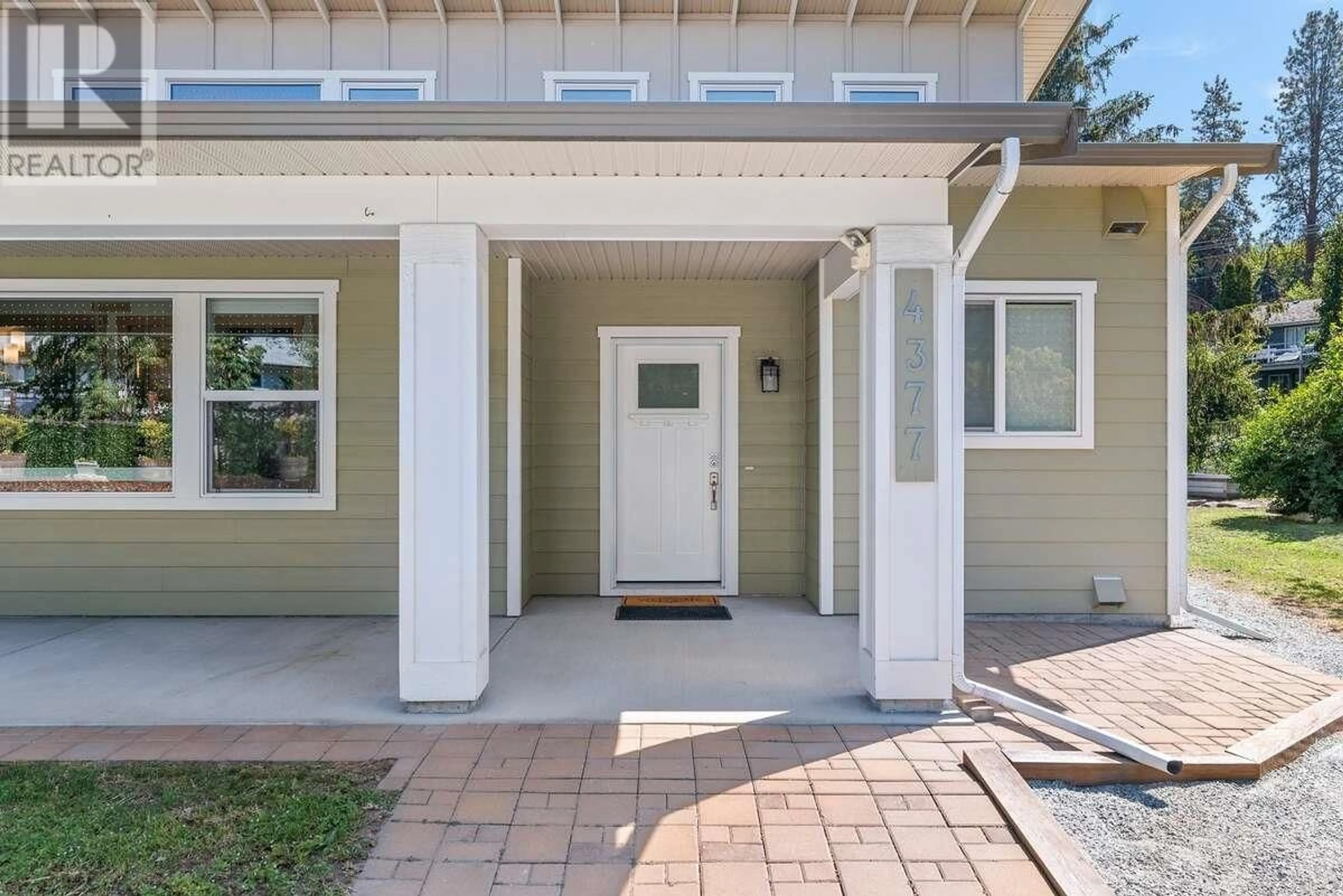 Home with vinyl exterior material, street for 4377 GORDON DRIVE, Kelowna British Columbia V1W1S7