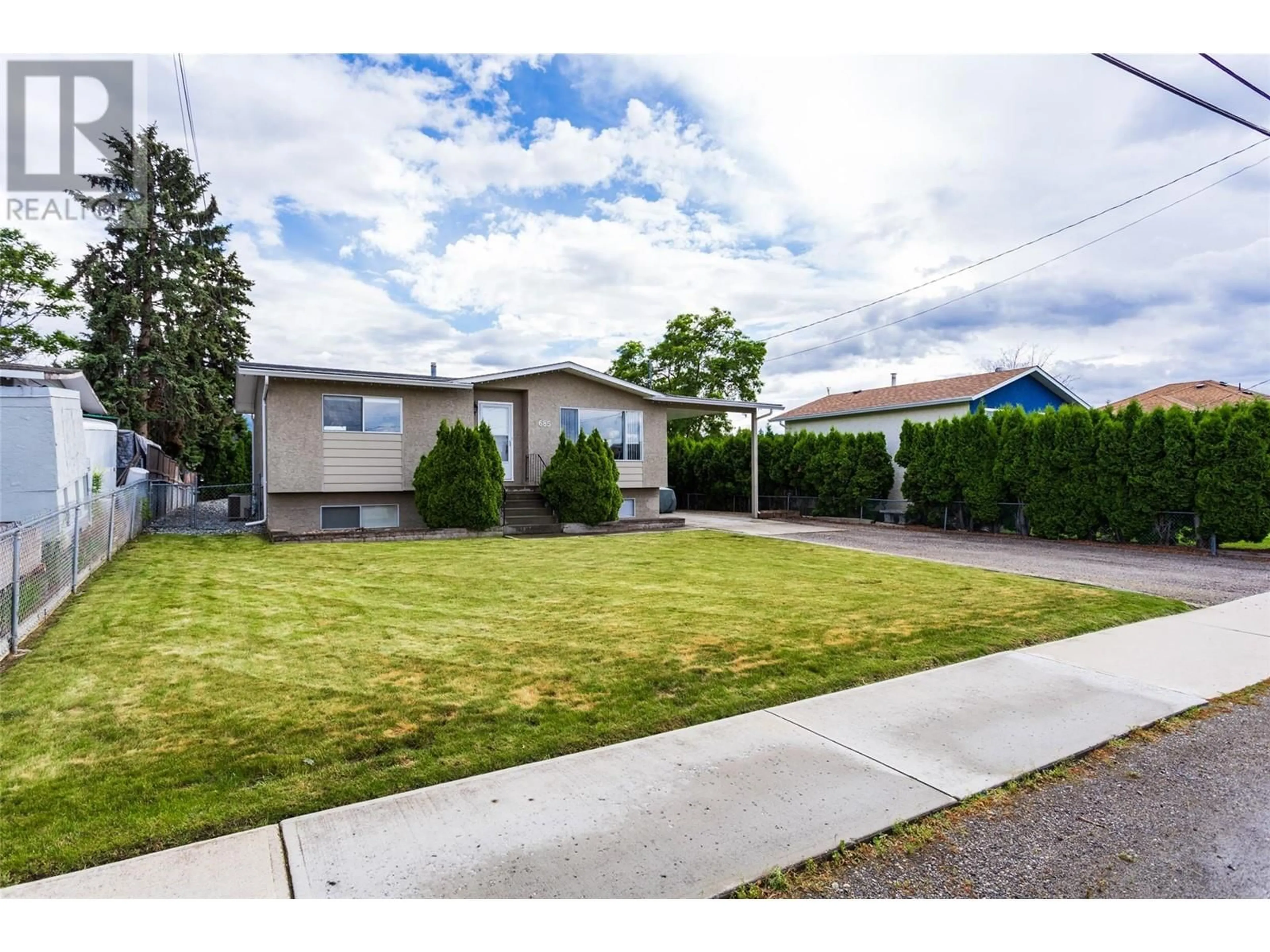 A pic from outside/outdoor area/front of a property/back of a property/a pic from drone, street for 685 Quigley Road, Kelowna British Columbia V1X1A6