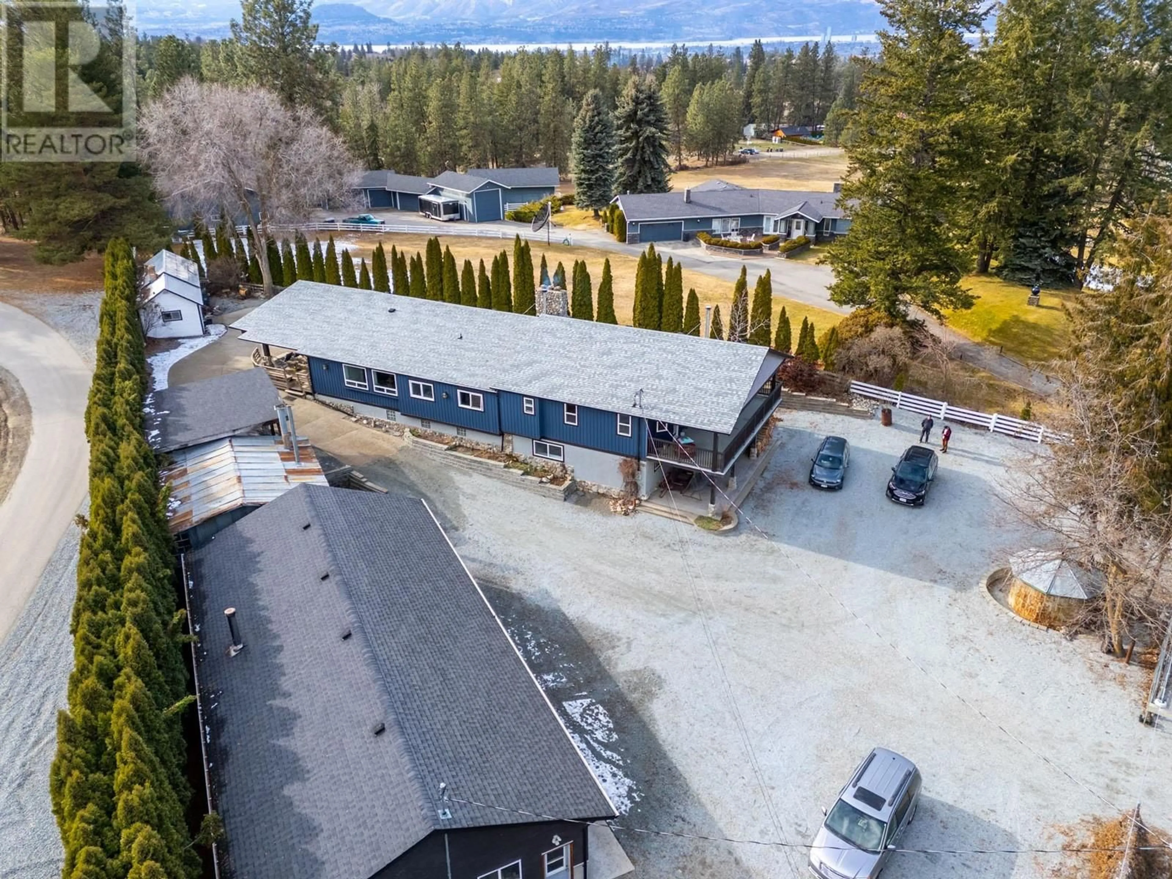 A pic from outside/outdoor area/front of a property/back of a property/a pic from drone, mountain view for 4150 JUNE SPRINGS ROAD, Kelowna British Columbia V1W4C9