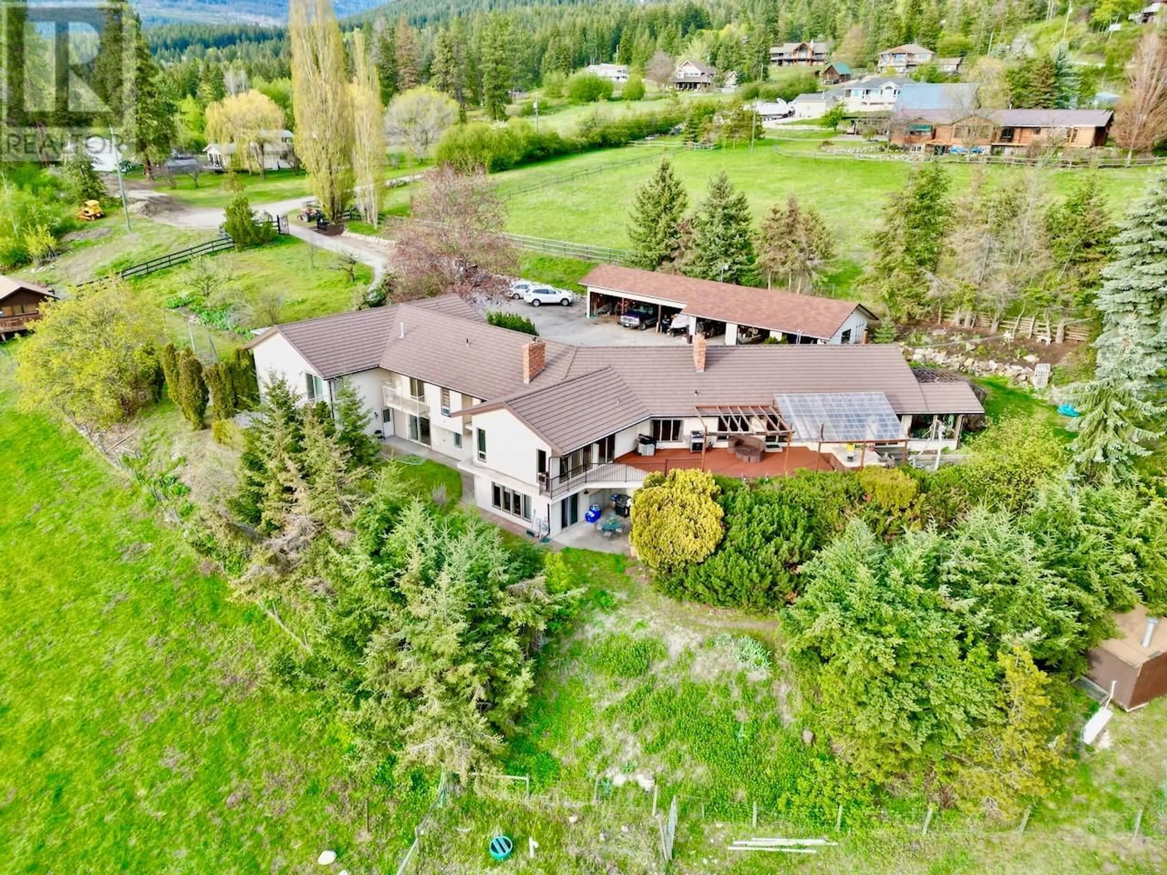 A pic from outside/outdoor area/front of a property/back of a property/a pic from drone, mountain view for 5620 NEIL ROAD, Vernon British Columbia V1B3J5