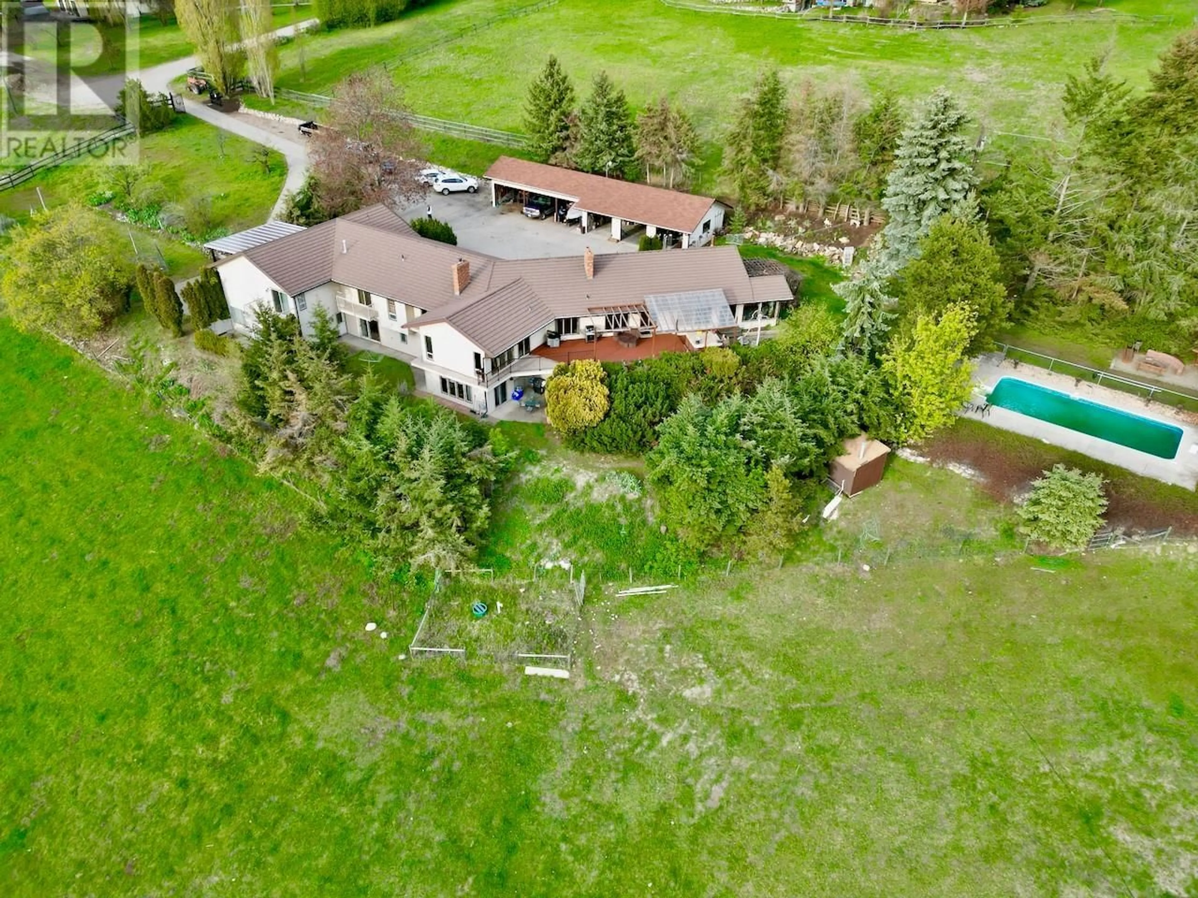 A pic from outside/outdoor area/front of a property/back of a property/a pic from drone, unknown for 5620 NEIL ROAD, Vernon British Columbia V1B3J5