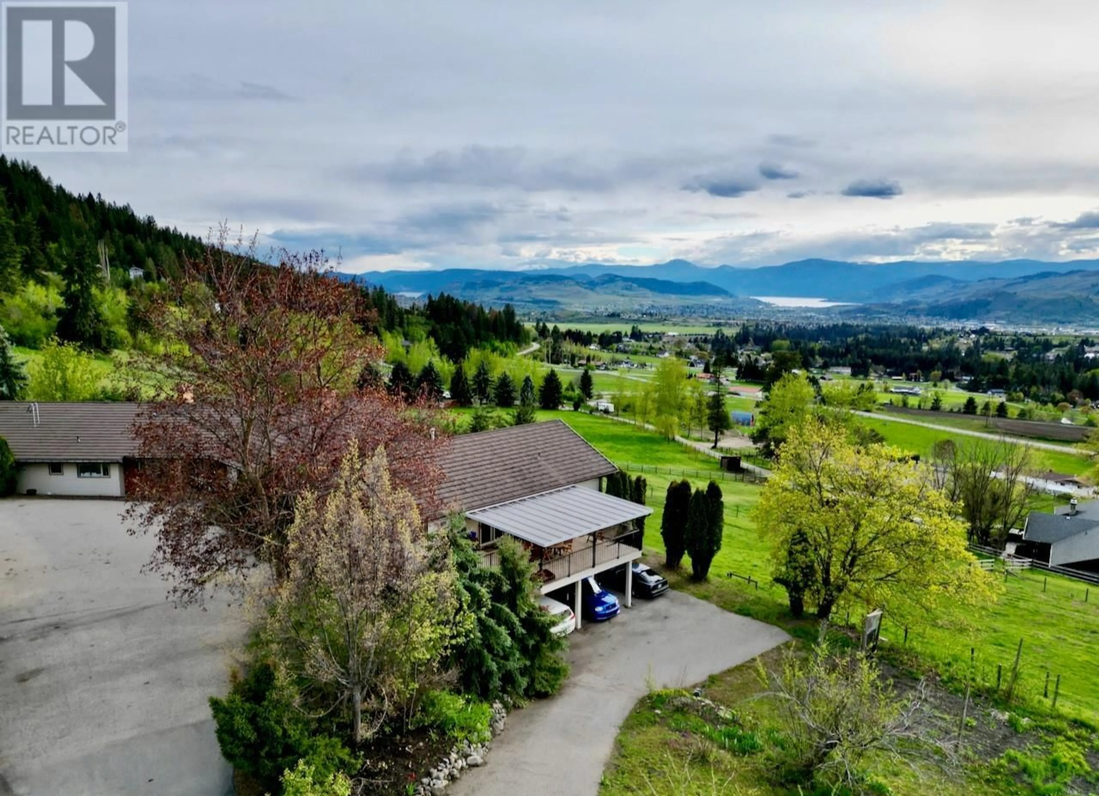A pic from outside/outdoor area/front of a property/back of a property/a pic from drone, mountain view for 5620 NEIL ROAD, Vernon British Columbia V1B3J5