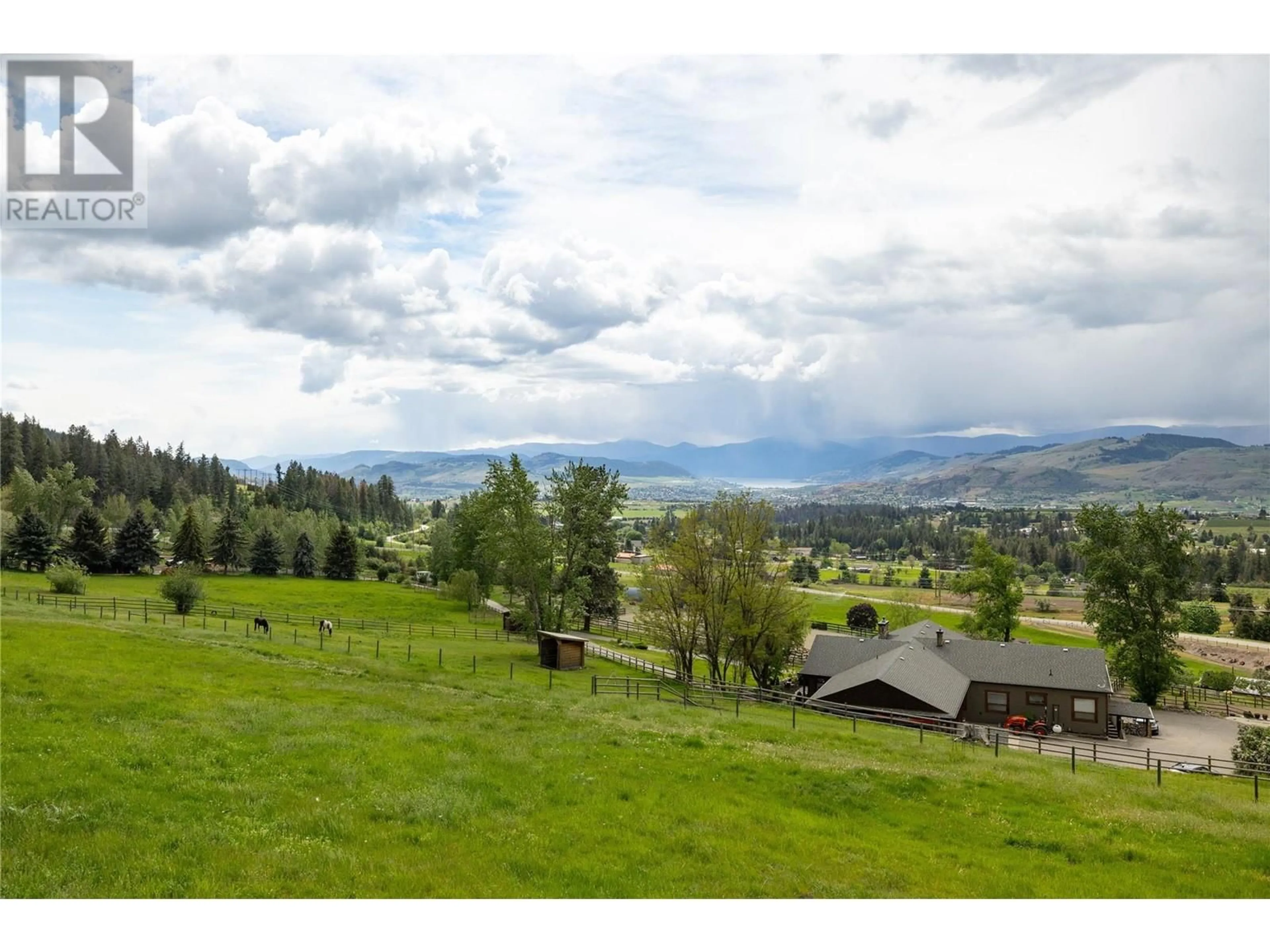 A pic from outside/outdoor area/front of a property/back of a property/a pic from drone, mountain view for 5620 NEIL ROAD, Vernon British Columbia V1B3J5