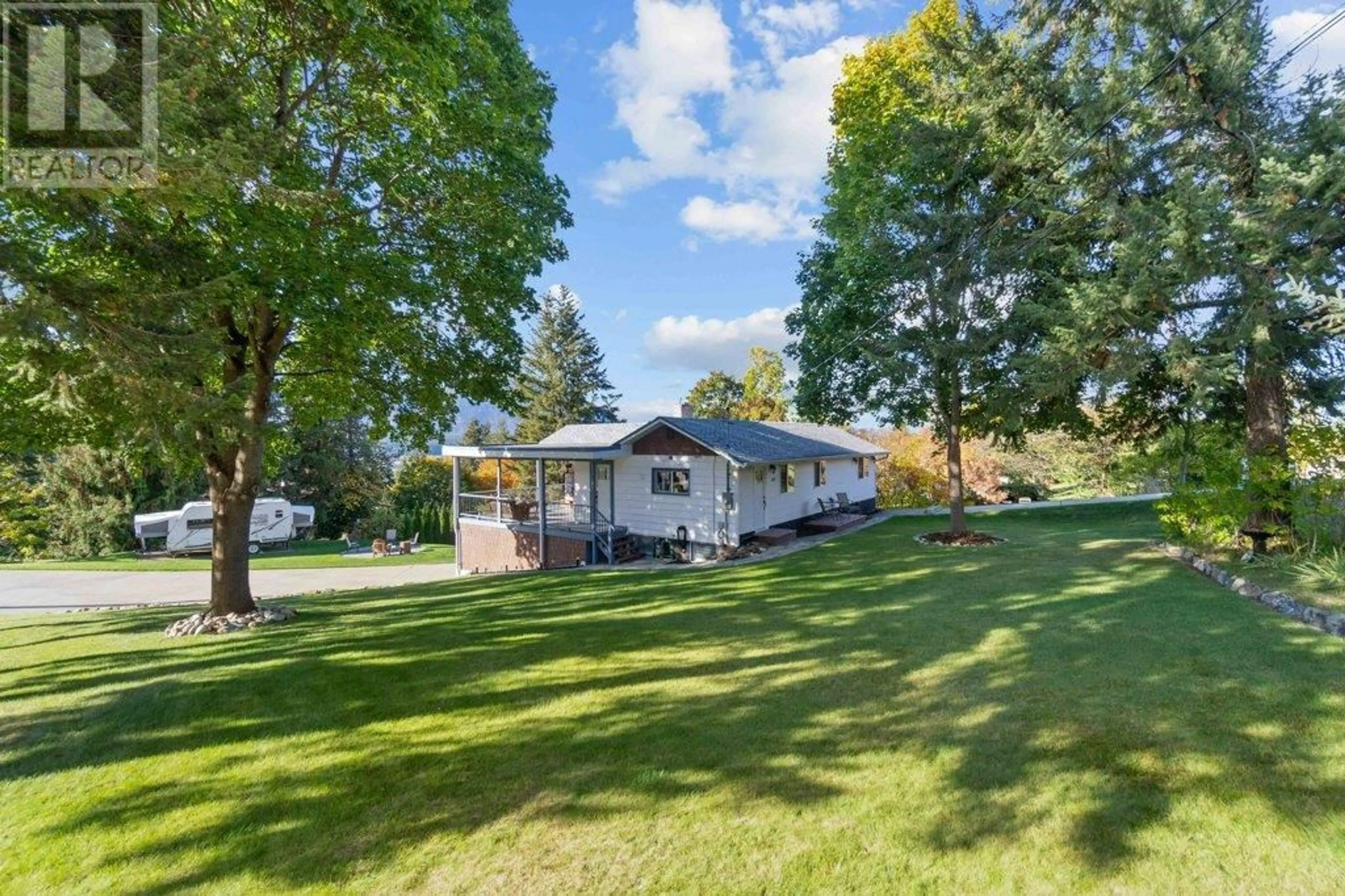 A pic from outside/outdoor area/front of a property/back of a property/a pic from drone, water/lake/river/ocean view for 1171 15 STREET SOUTHEAST, Salmon Arm British Columbia V1E2E3