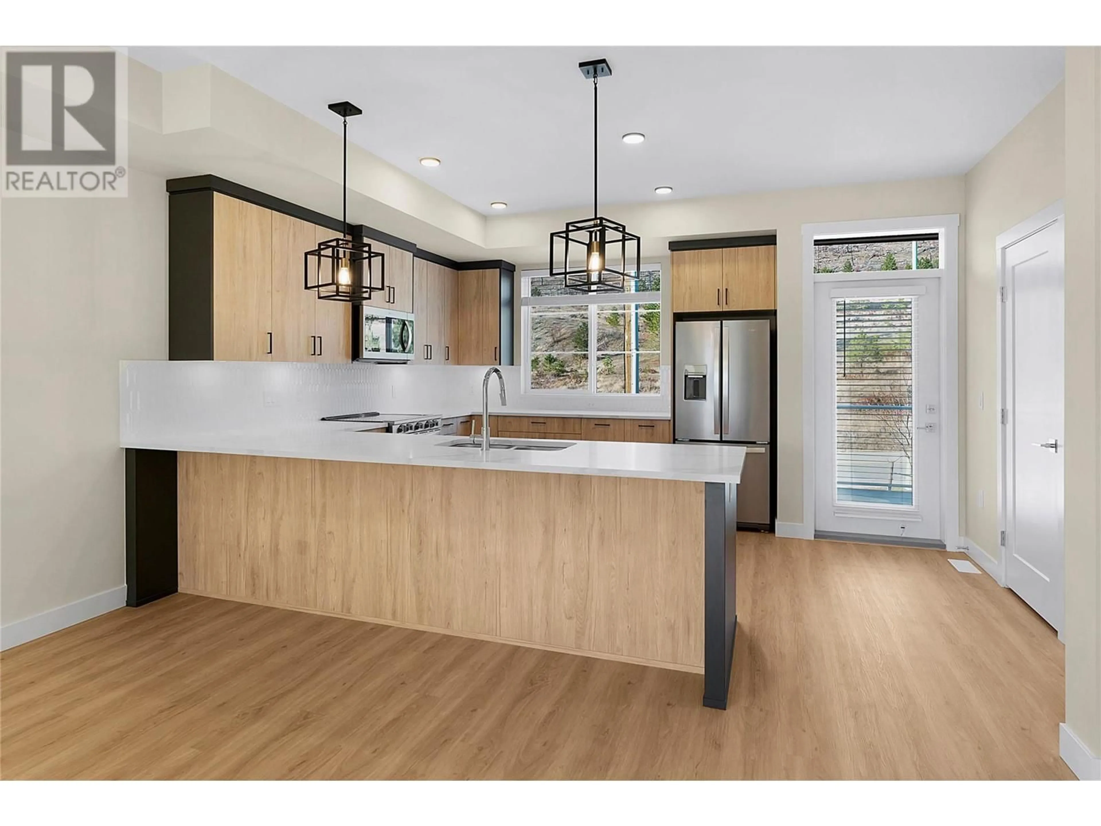Open concept kitchen, wood/laminate floor for 179 - 4025 GELLATLY ROAD SOUTH, West Kelowna British Columbia V4T0E6