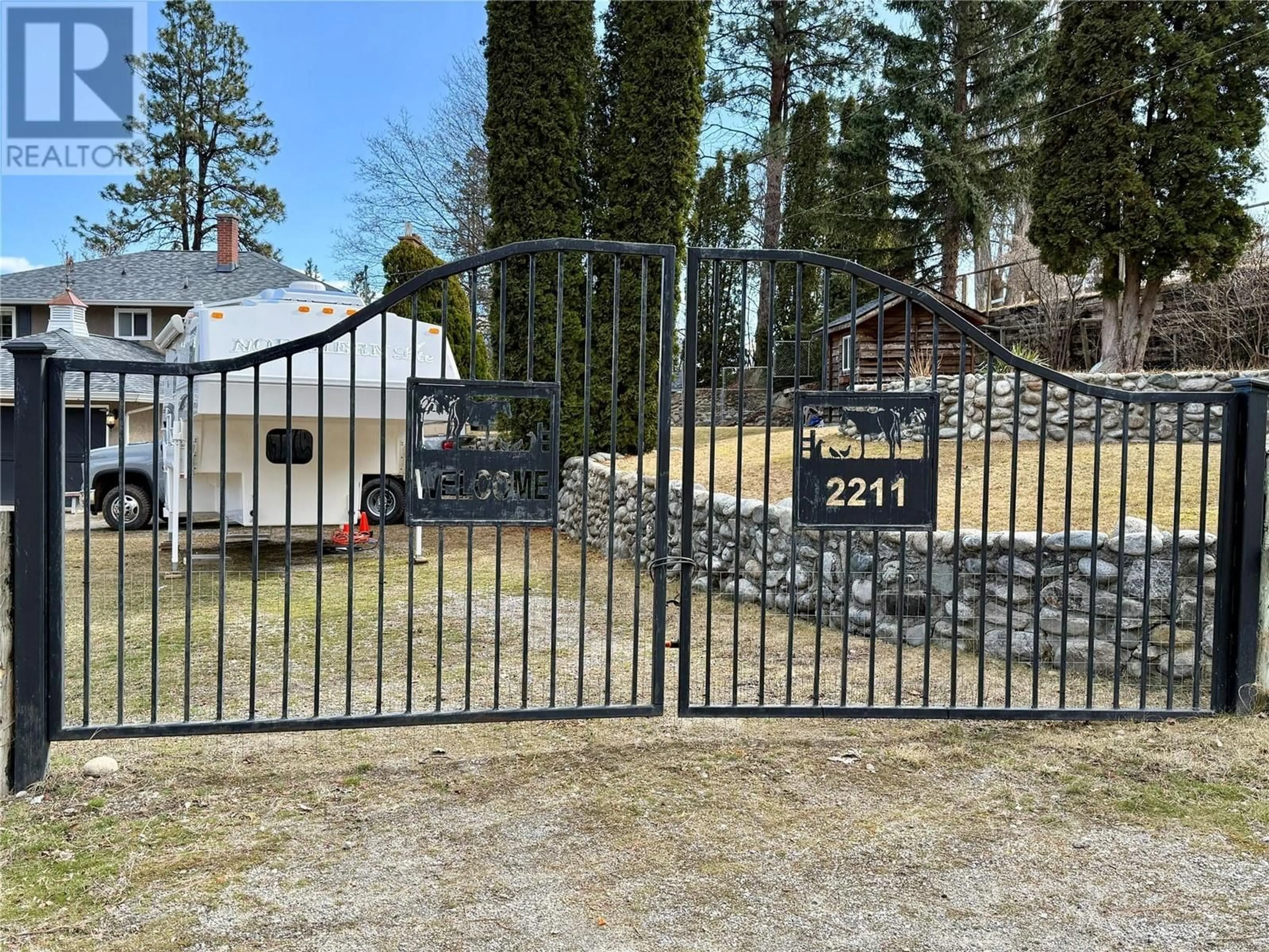 A pic from outside/outdoor area/front of a property/back of a property/a pic from drone, street for 2211 WEST BENCH DRIVE, Penticton British Columbia V2A8Z8