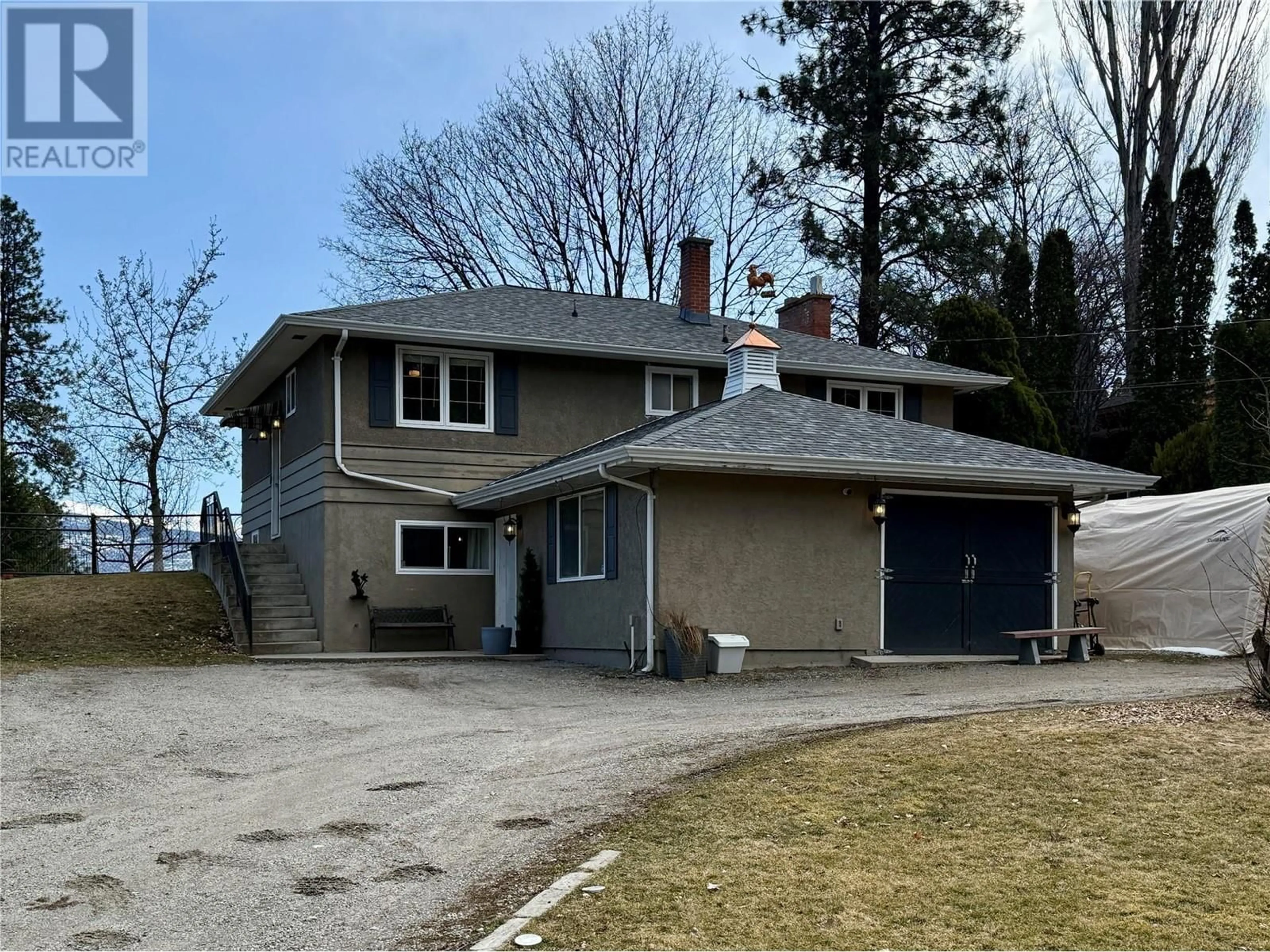 A pic from outside/outdoor area/front of a property/back of a property/a pic from drone, street for 2211 WEST BENCH DRIVE, Penticton British Columbia V2A8Z8