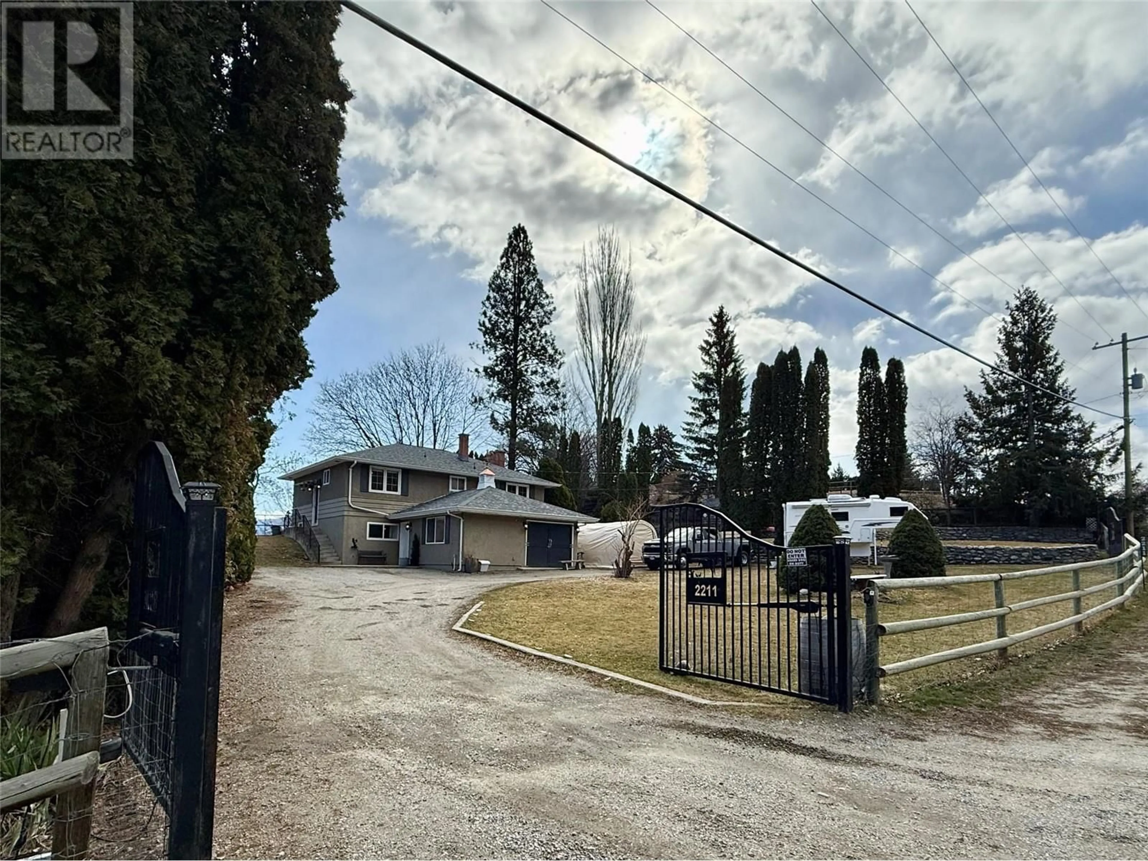 A pic from outside/outdoor area/front of a property/back of a property/a pic from drone, street for 2211 WEST BENCH DRIVE, Penticton British Columbia V2A8Z8
