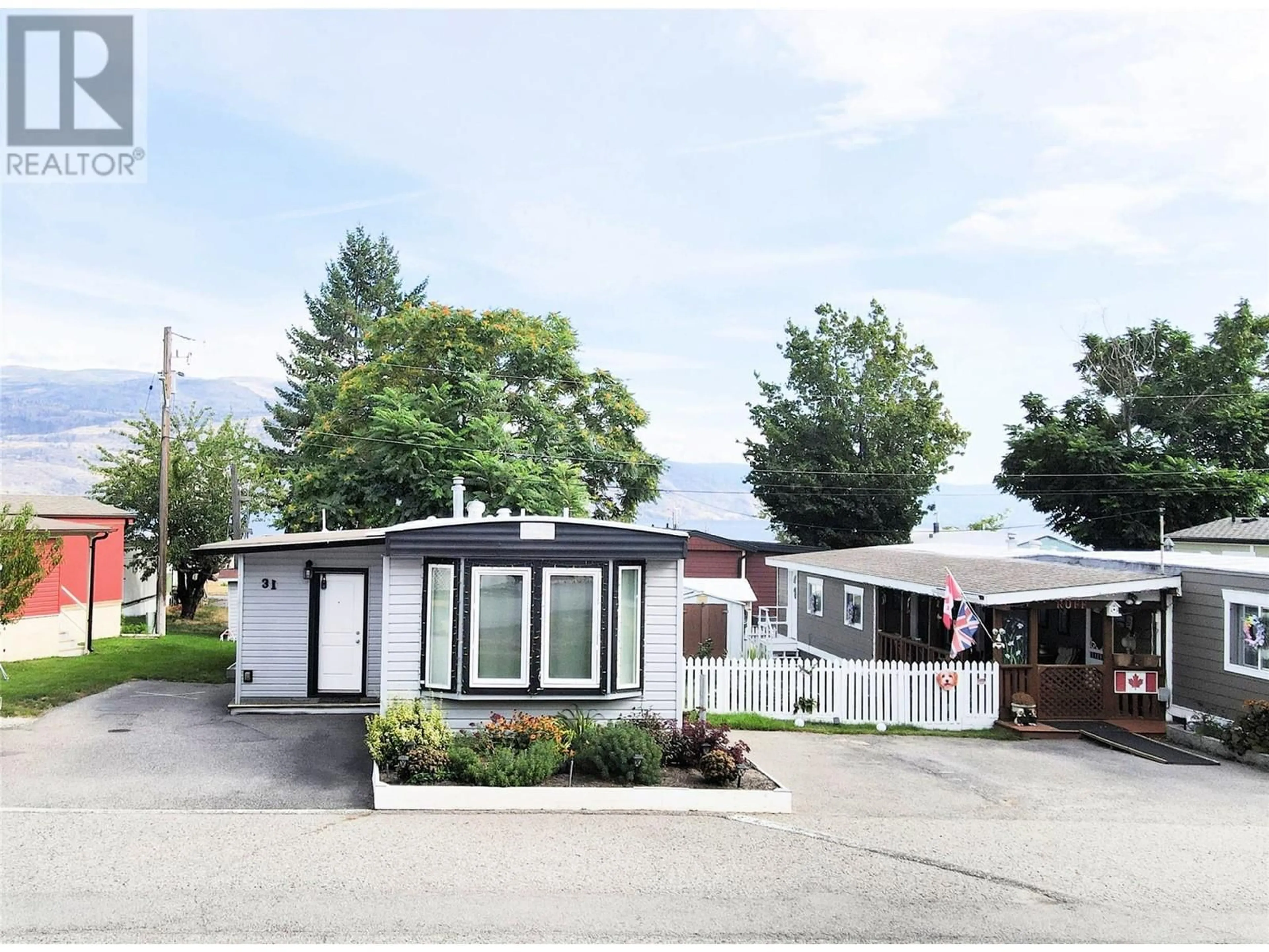 Home with vinyl exterior material, street for 31 - 6663 HIGHWAY 97 OTHER SOUTH, Peachland British Columbia V0H1X7