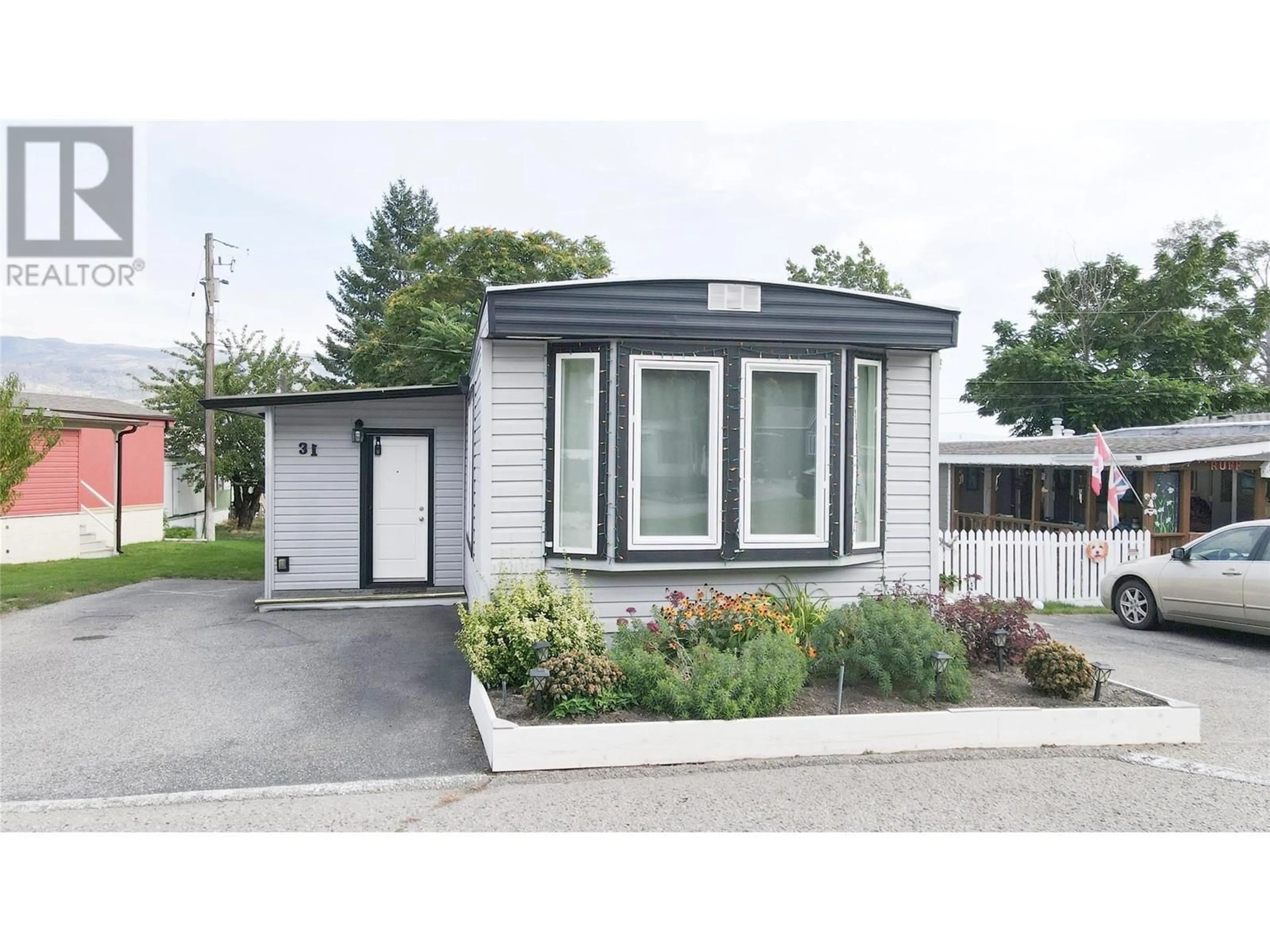 Home with vinyl exterior material, street for 31 - 6663 HIGHWAY 97 OTHER SOUTH, Peachland British Columbia V0H1X7