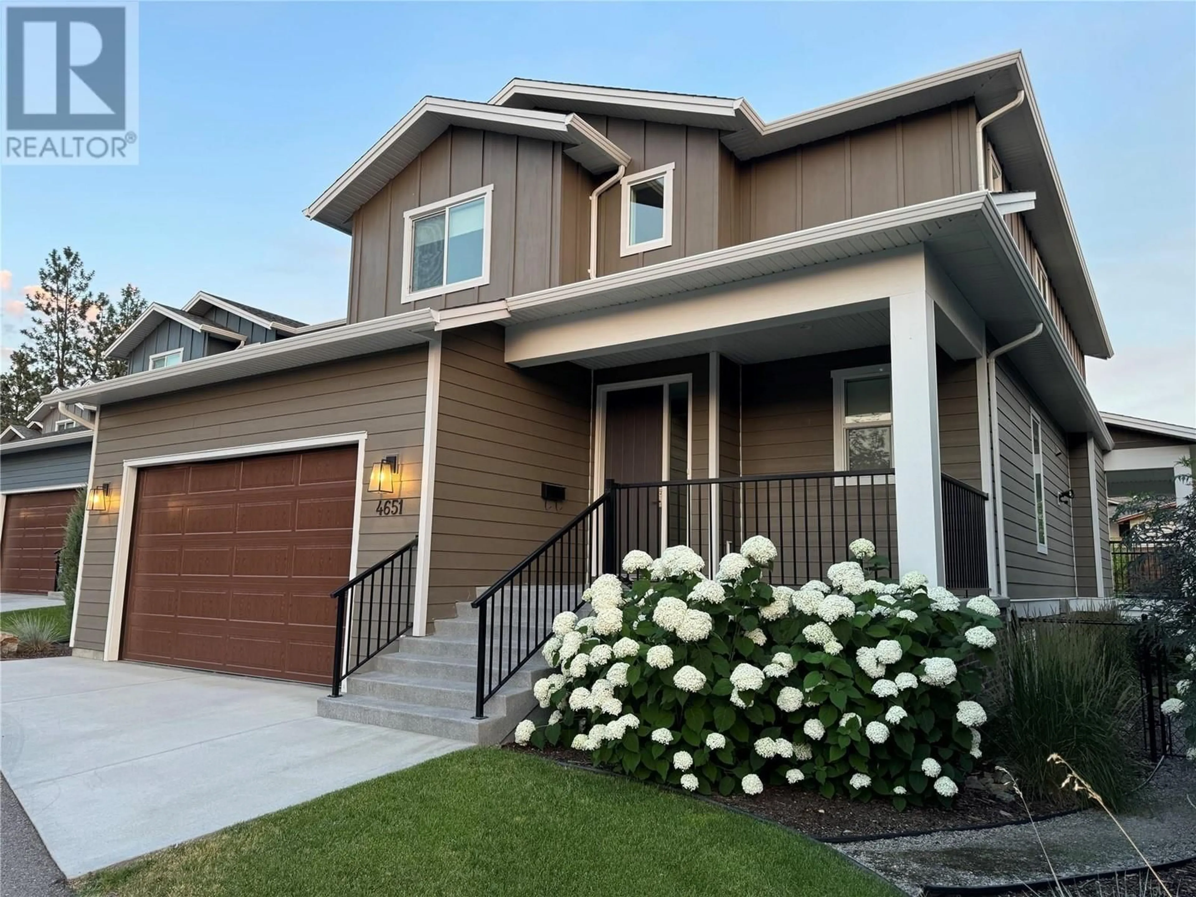 Home with vinyl exterior material, street for 4651 Raymer Road, Kelowna British Columbia V1W1J4