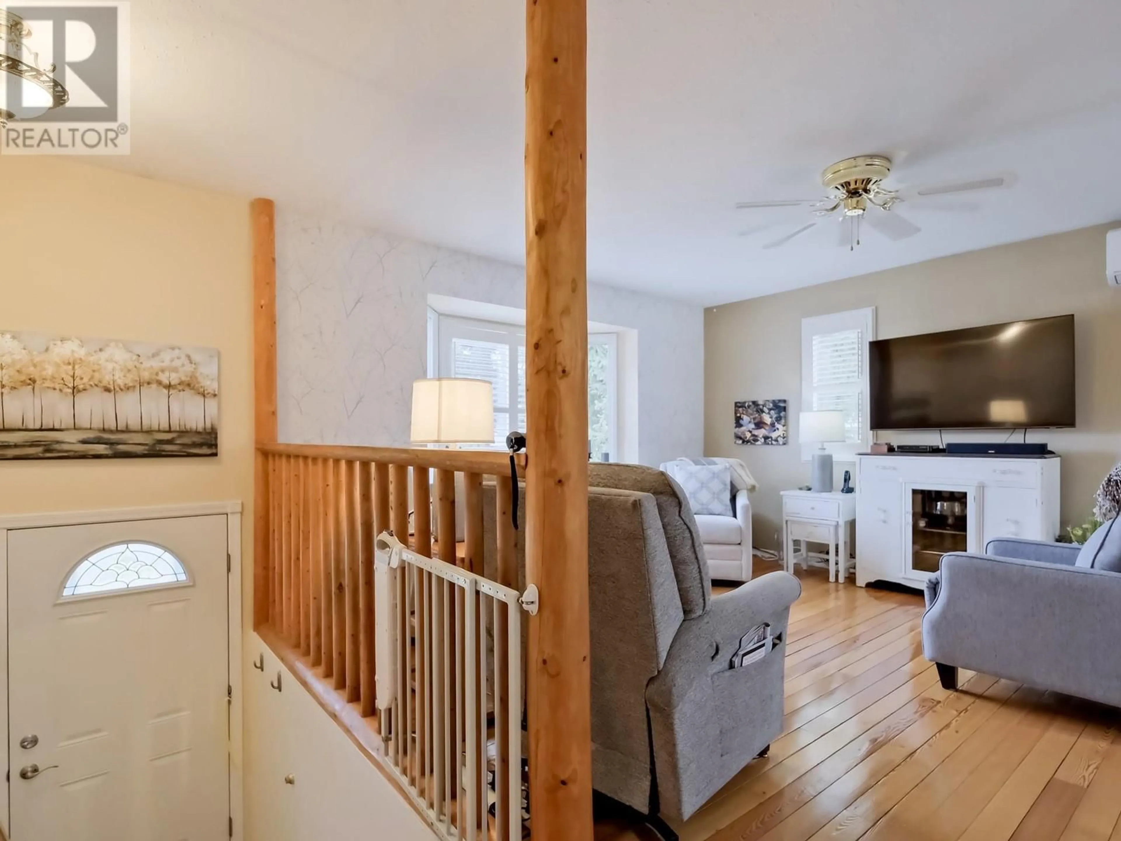 Living room with furniture, wood/laminate floor for 5882 VICTORIA STREET, Peachland British Columbia V0X1X4