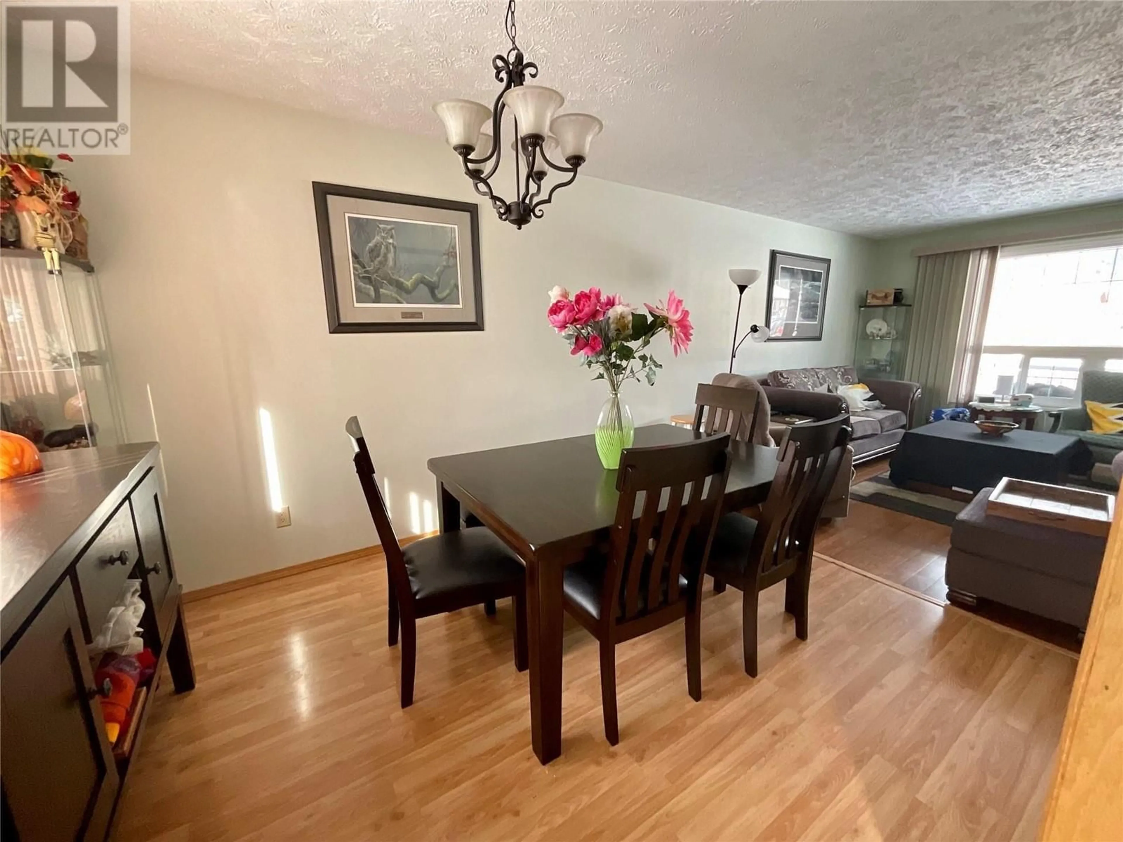 Dining room, wood/laminate floor for 319 PEACE RIVER CRESCENT, Tumbler Ridge British Columbia V0C2W0