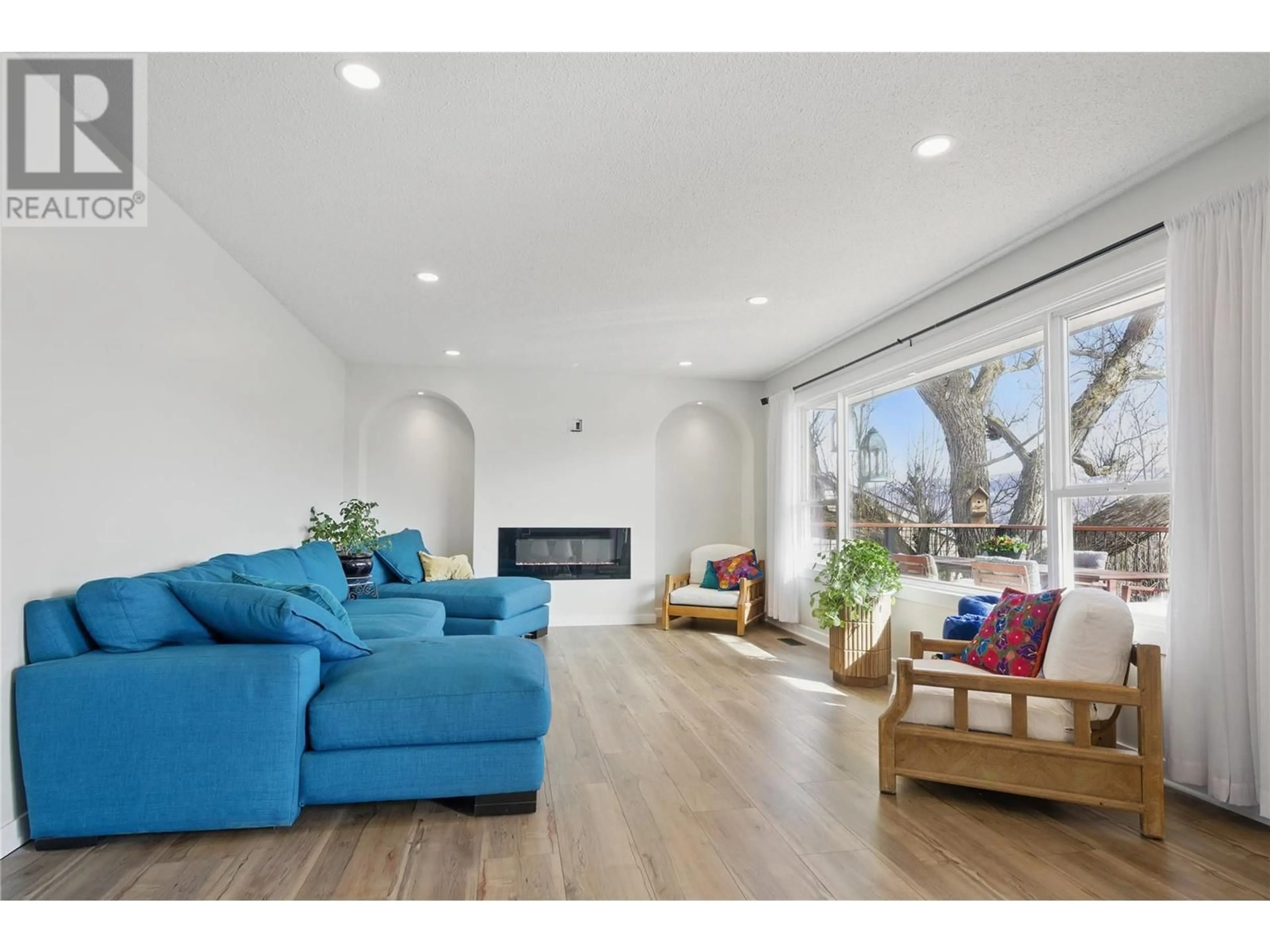 Living room with furniture, wood/laminate floor for 3754 CARRALL ROAD, West Kelowna British Columbia V4t2C6