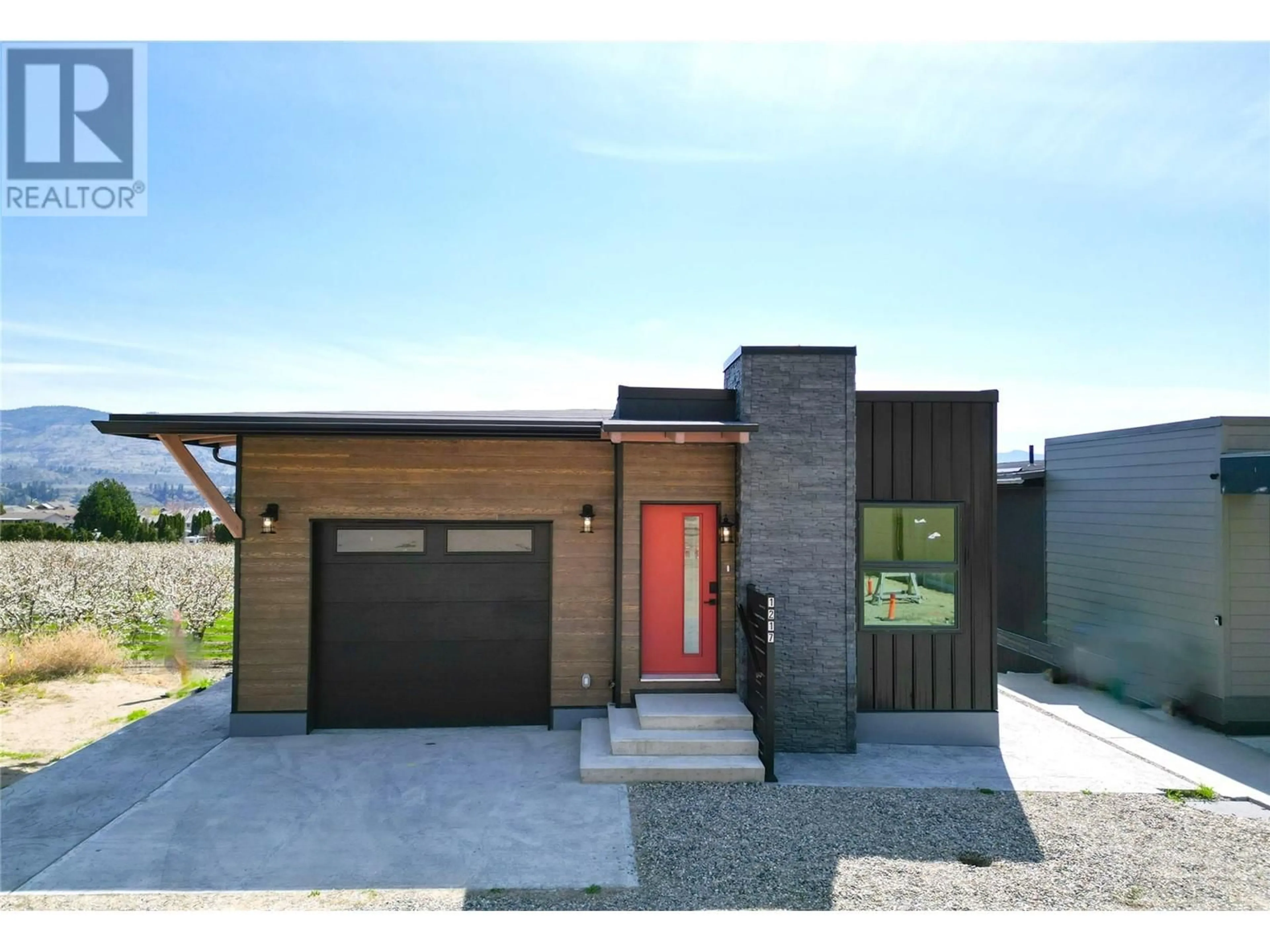 Home with brick exterior material, street for 1217 COPPER ROAD, Oliver British Columbia V0H1T1
