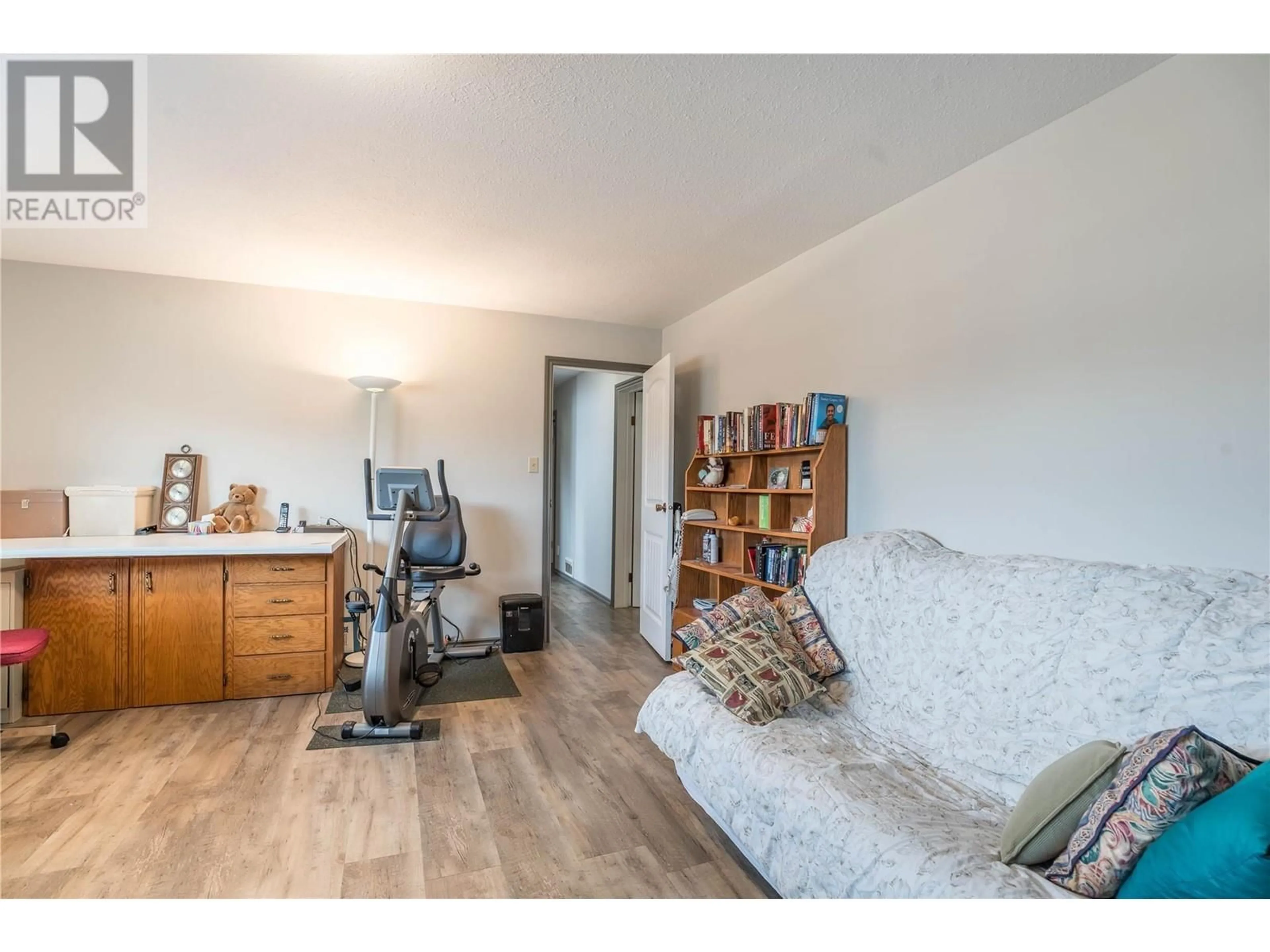 Living room with furniture, wood/laminate floor for 9181 ALDER STREET, Summerland British Columbia V0H1Z2