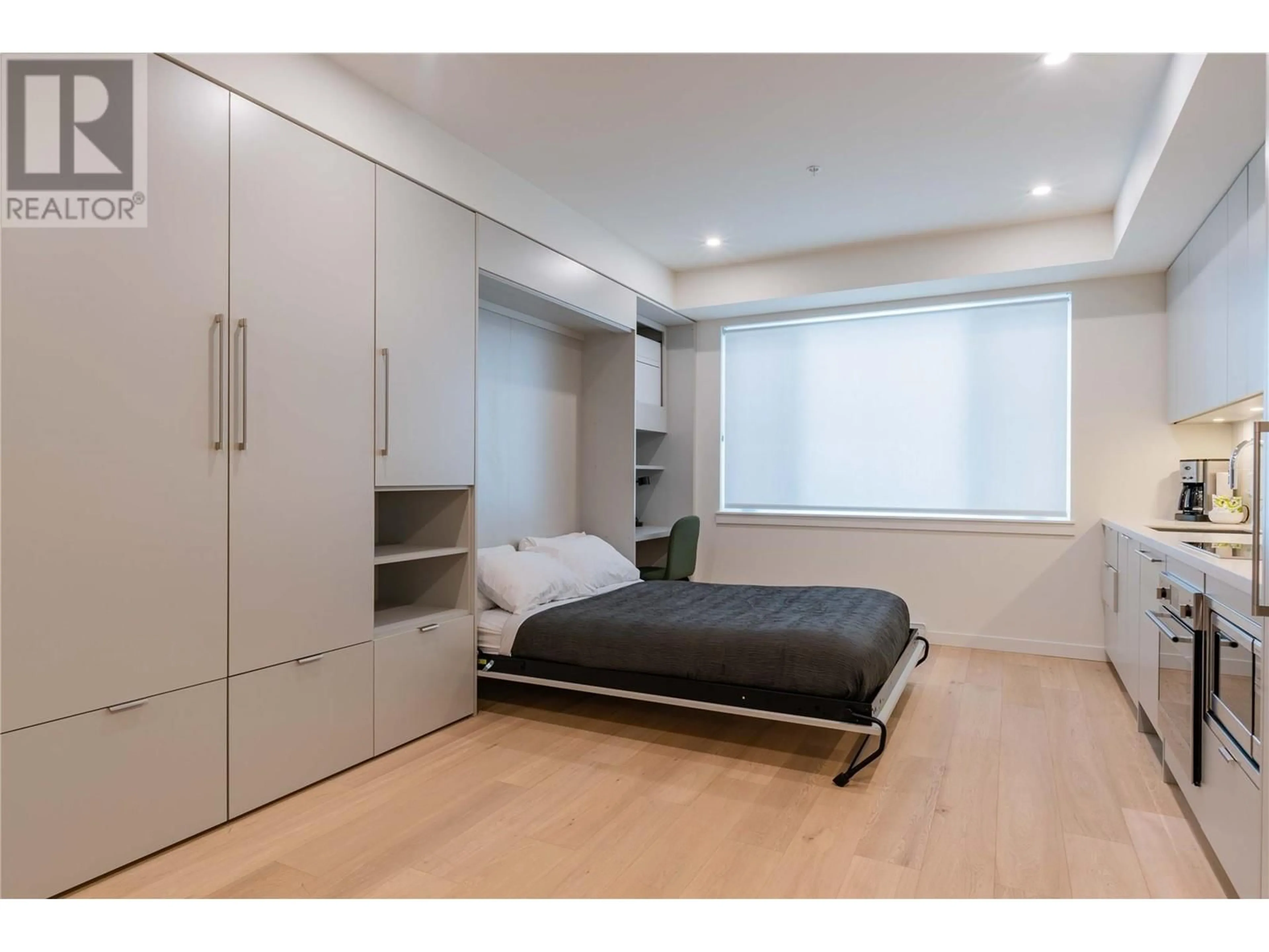 Bedroom with bed, wood/laminate floor for 122 - 4280 RED MOUNTAIN ROAD, Rossland British Columbia V0G1Y0