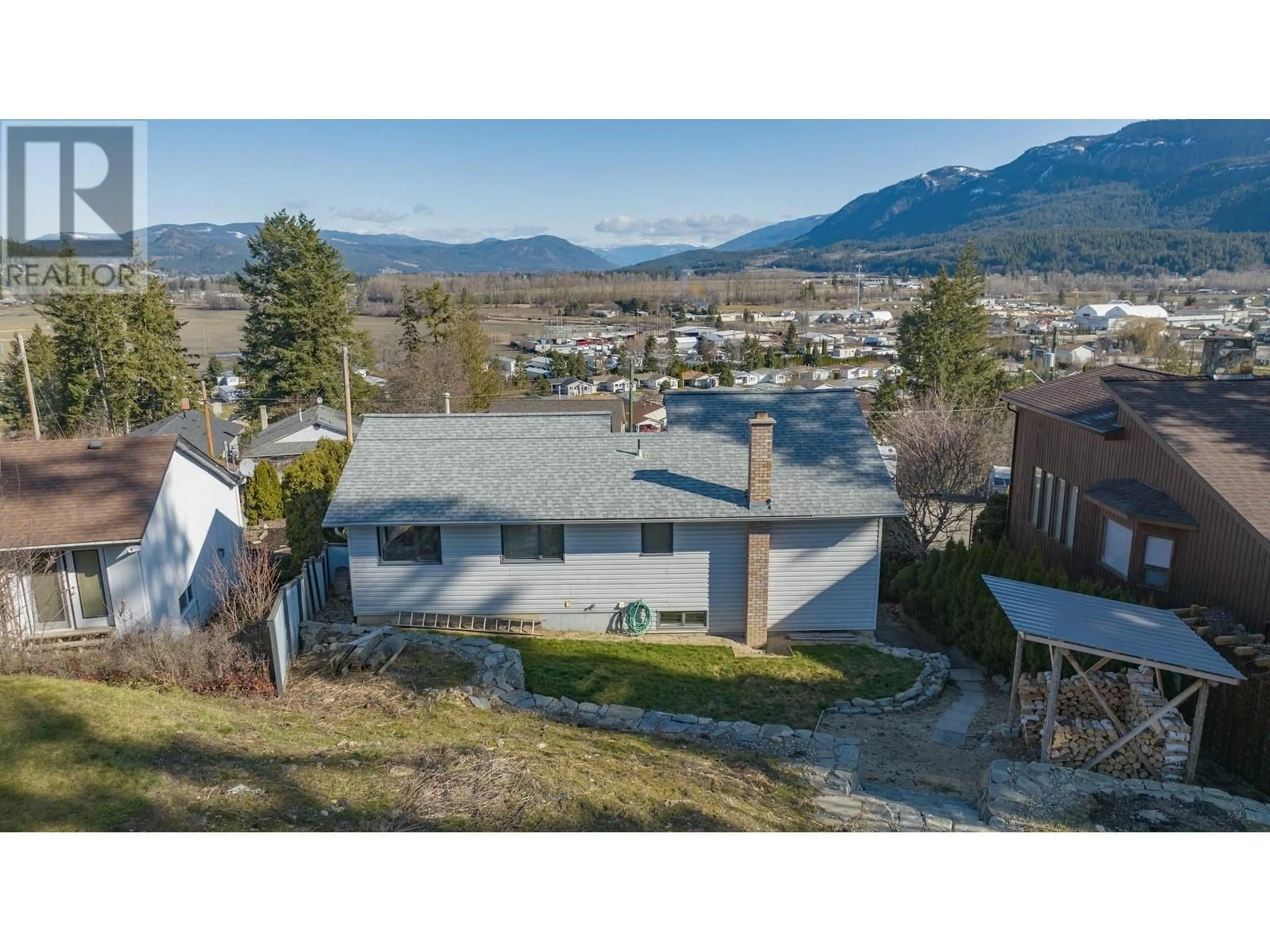 A pic from outside/outdoor area/front of a property/back of a property/a pic from drone, mountain view for 135 BIRCH CRESCENT, Enderby British Columbia V4Y4C1