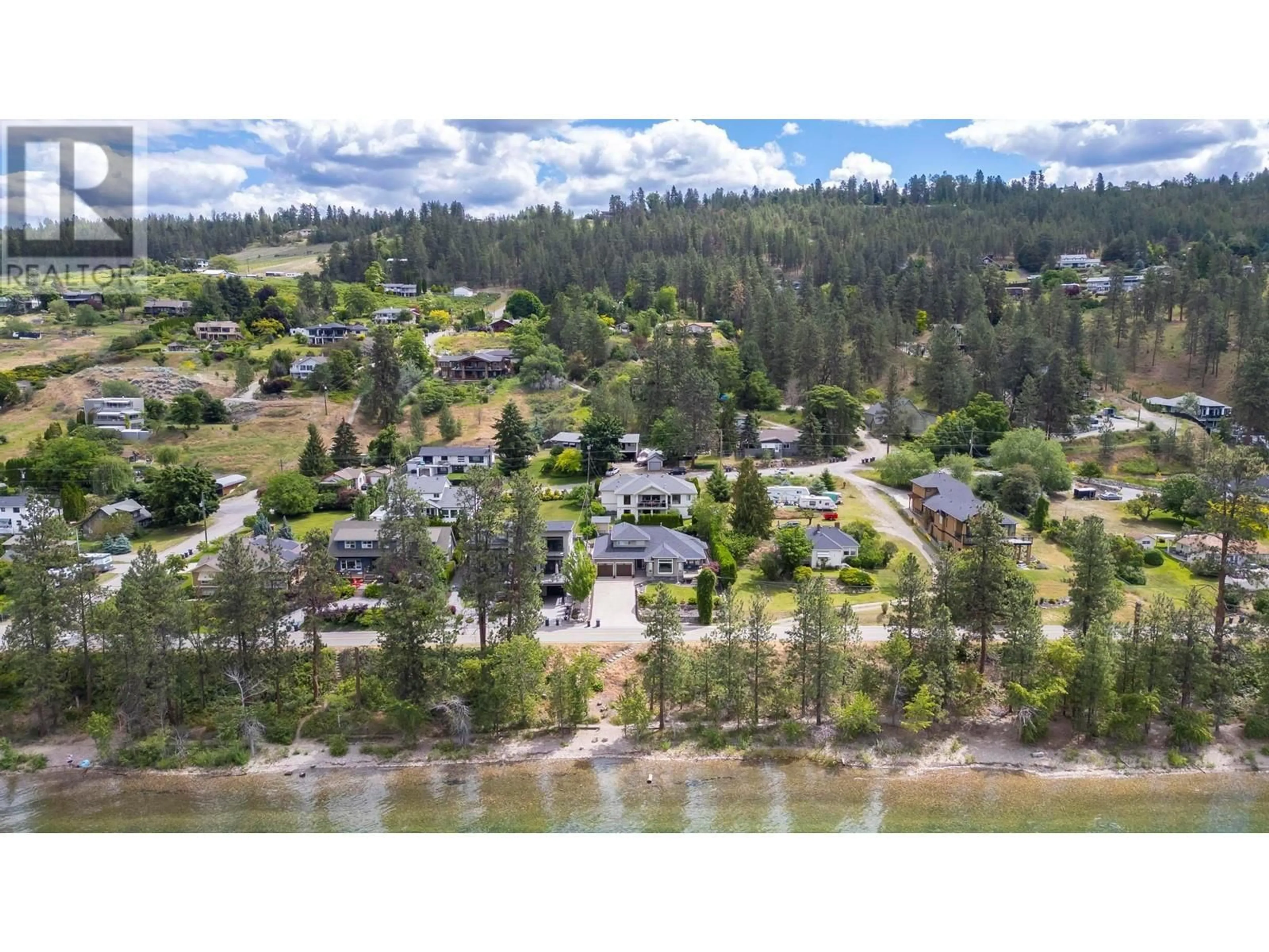 A pic from outside/outdoor area/front of a property/back of a property/a pic from drone, water/lake/river/ocean view for 11150 MADDOCK AVENUE, Lake Country British Columbia V4V2J7