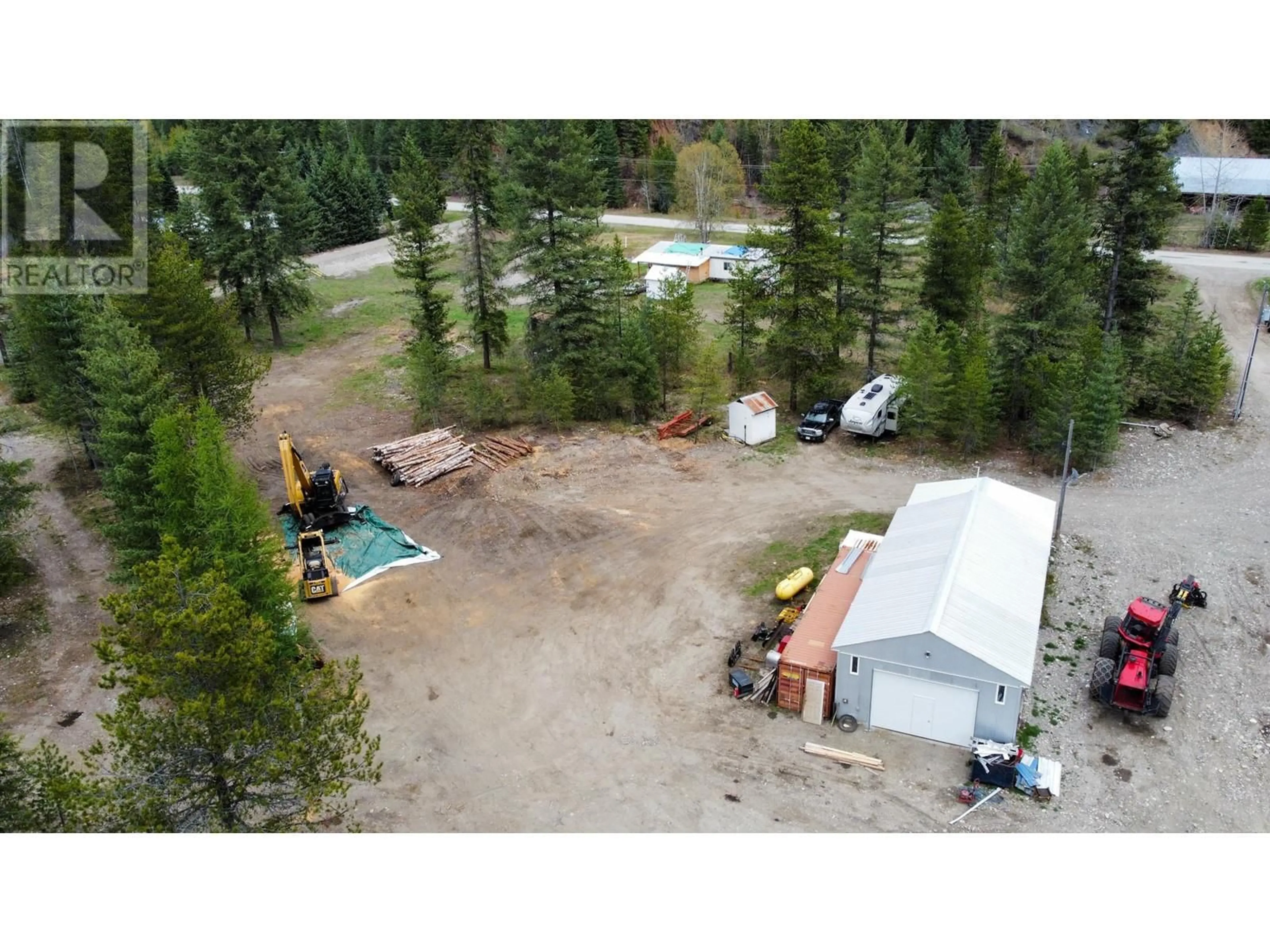 A pic from outside/outdoor area/front of a property/back of a property/a pic from drone, forest/trees view for 1978 AIRPORT ROAD, Salmo British Columbia V0G1Z0