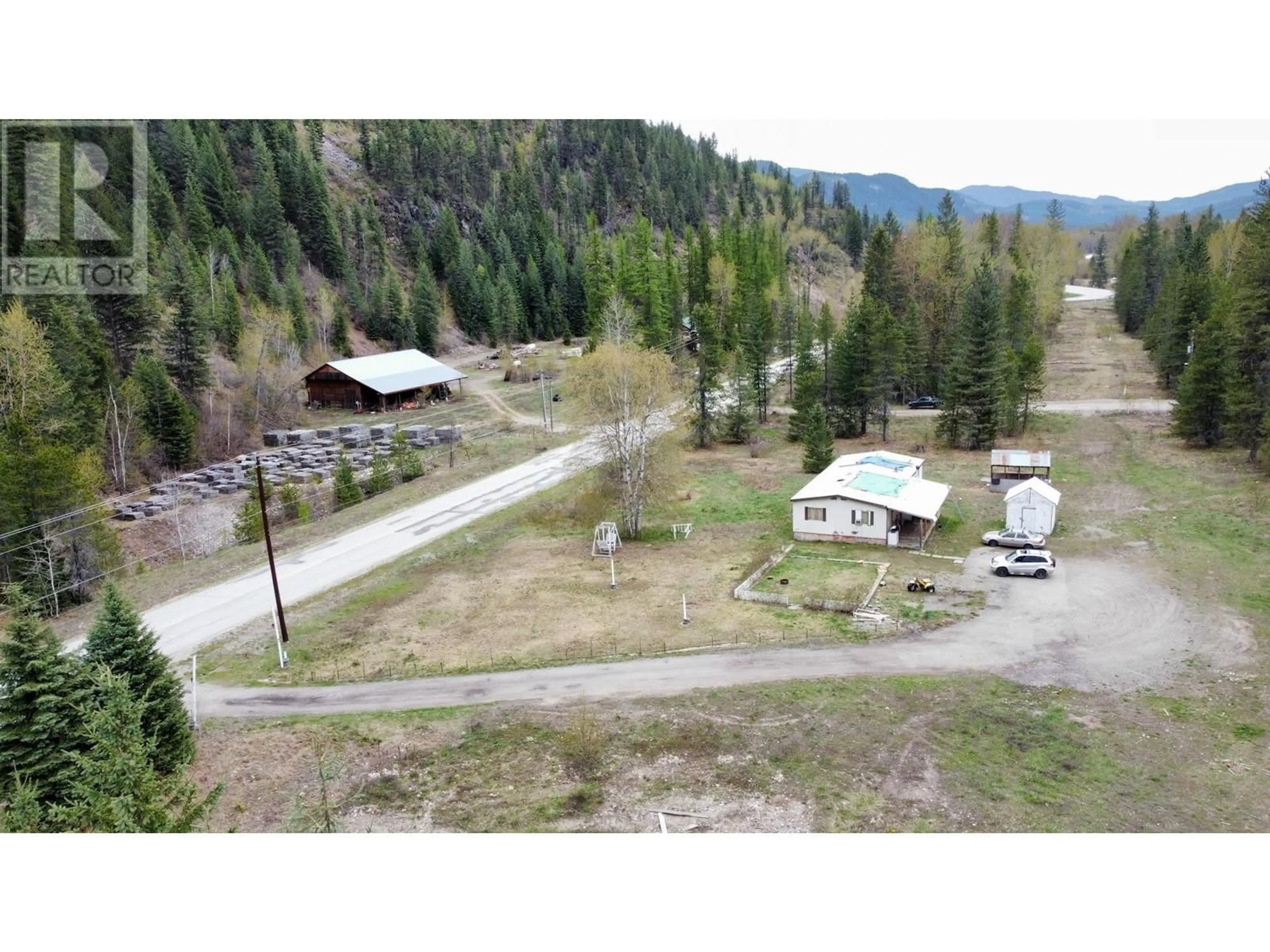 A pic from outside/outdoor area/front of a property/back of a property/a pic from drone, mountain view for 1978 AIRPORT ROAD, Salmo British Columbia V0G1Z0