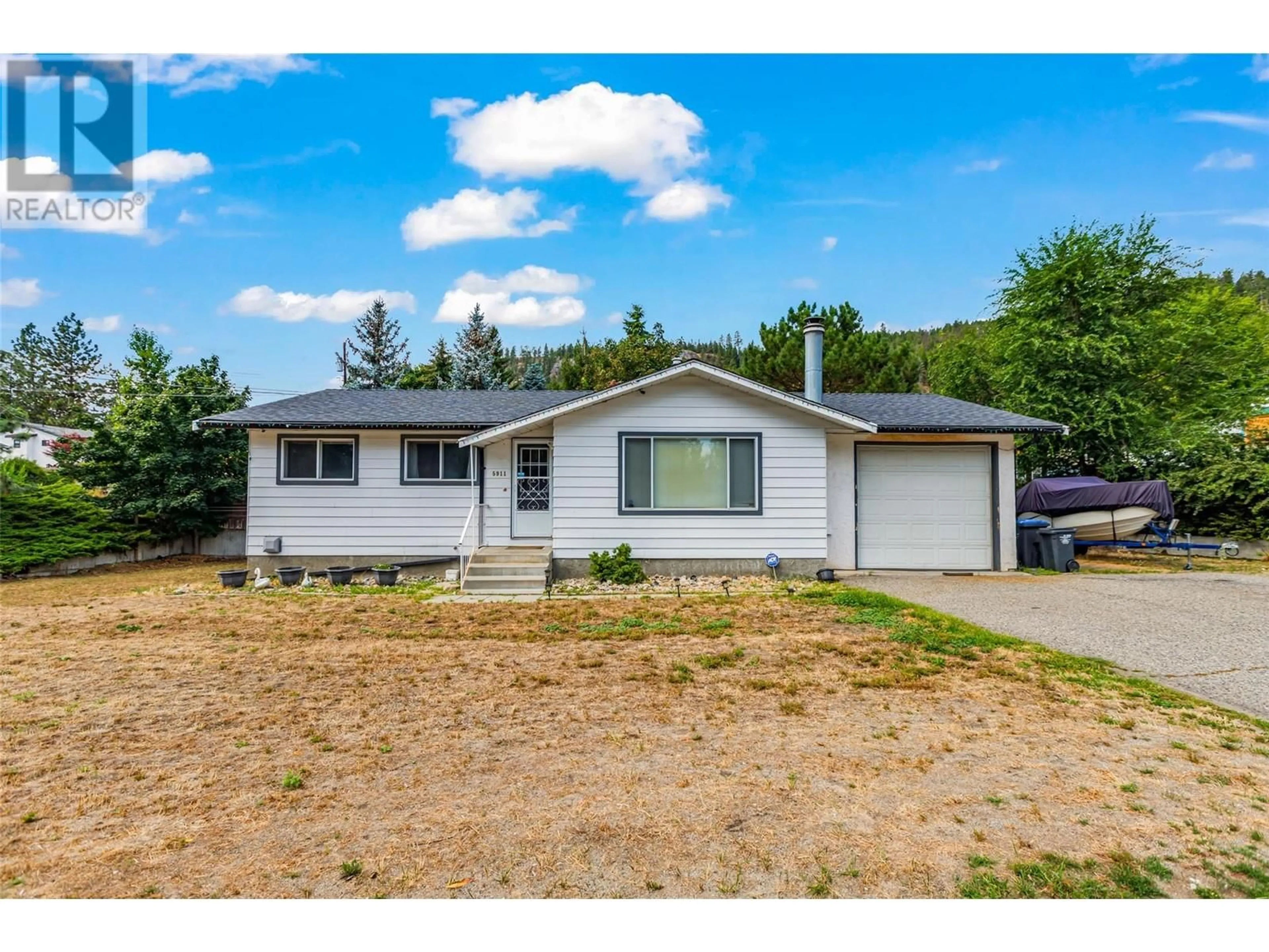 A pic from outside/outdoor area/front of a property/back of a property/a pic from drone, street for 5911 EHLERS ROAD, Peachland British Columbia V0H1X0