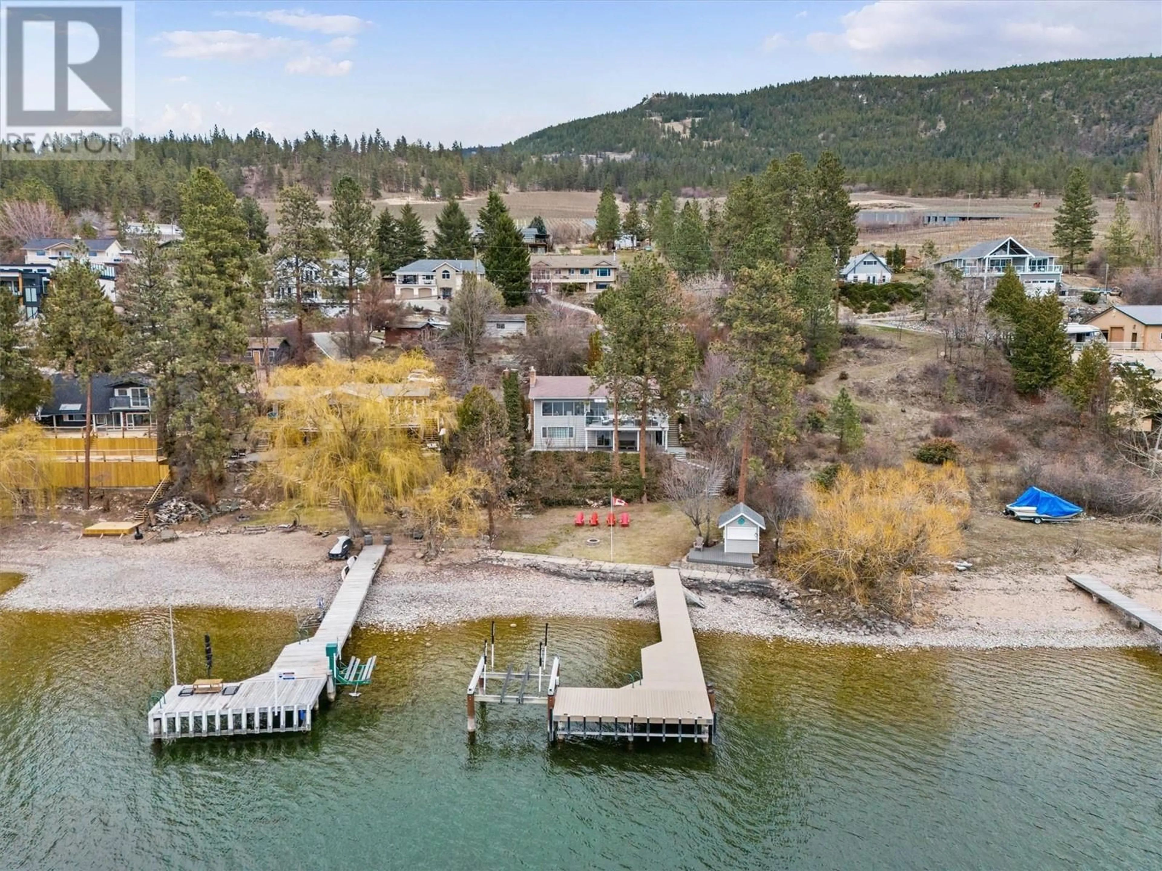 A pic from outside/outdoor area/front of a property/back of a property/a pic from drone, water/lake/river/ocean view for 17110 CORAL BEACH ROAD, Lake Country British Columbia V4V1B9