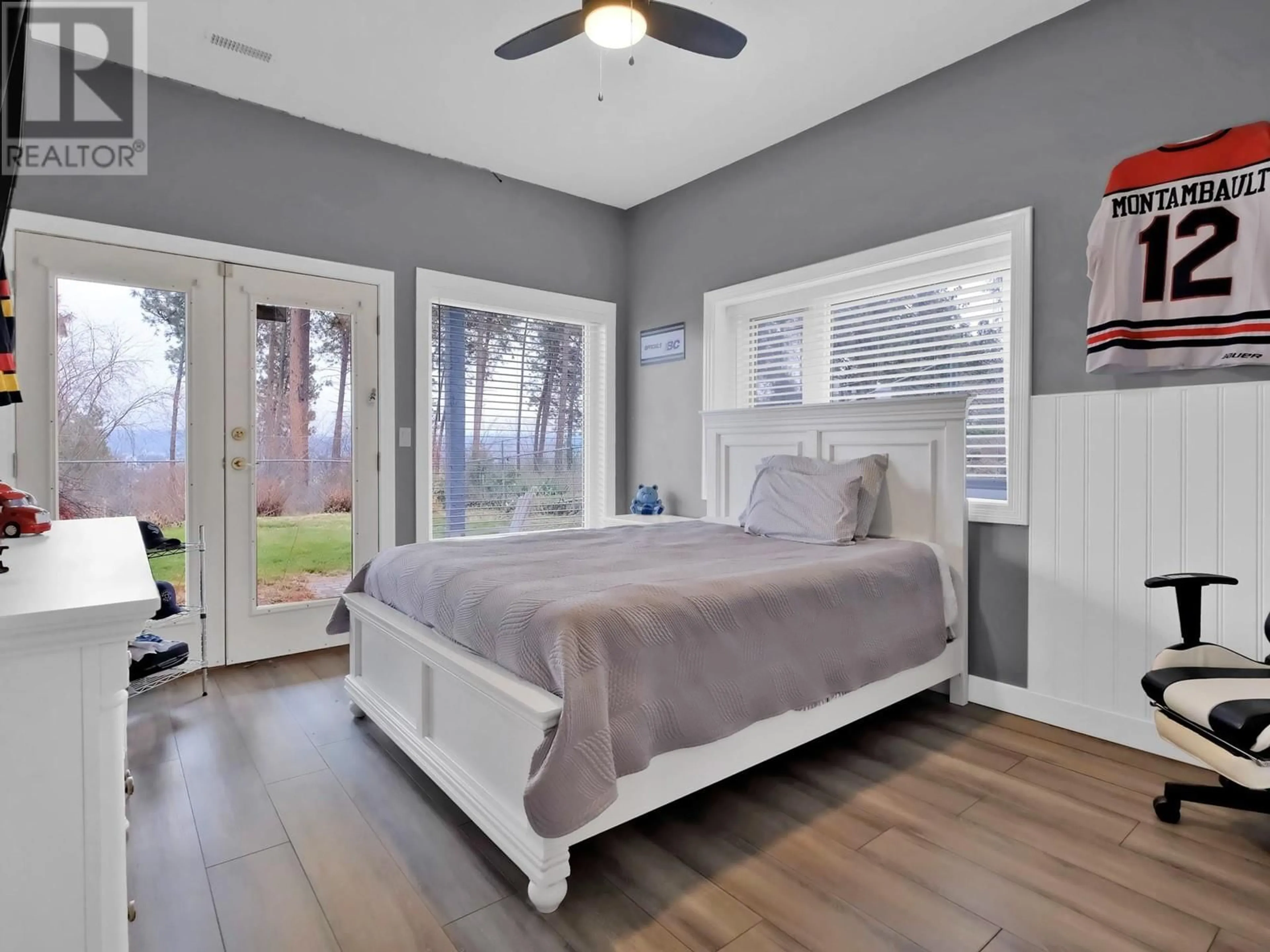 Bedroom with bed, wood/laminate floor for 1873 BAYVIEW COURT, Westbank British Columbia V1Z3M3
