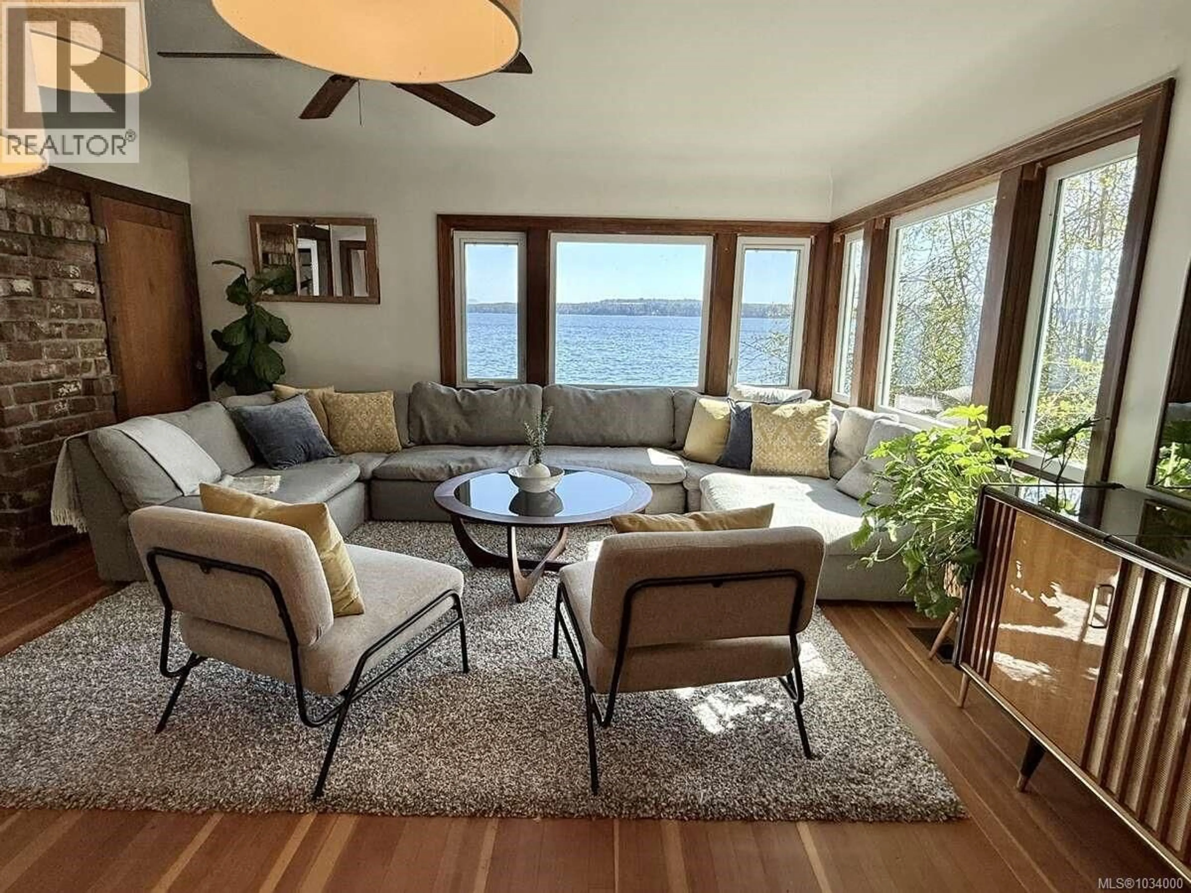 Living room with furniture, unknown for 5696 ISLAND HIGHWAY SOUTH, Union Bay British Columbia V0R3B0