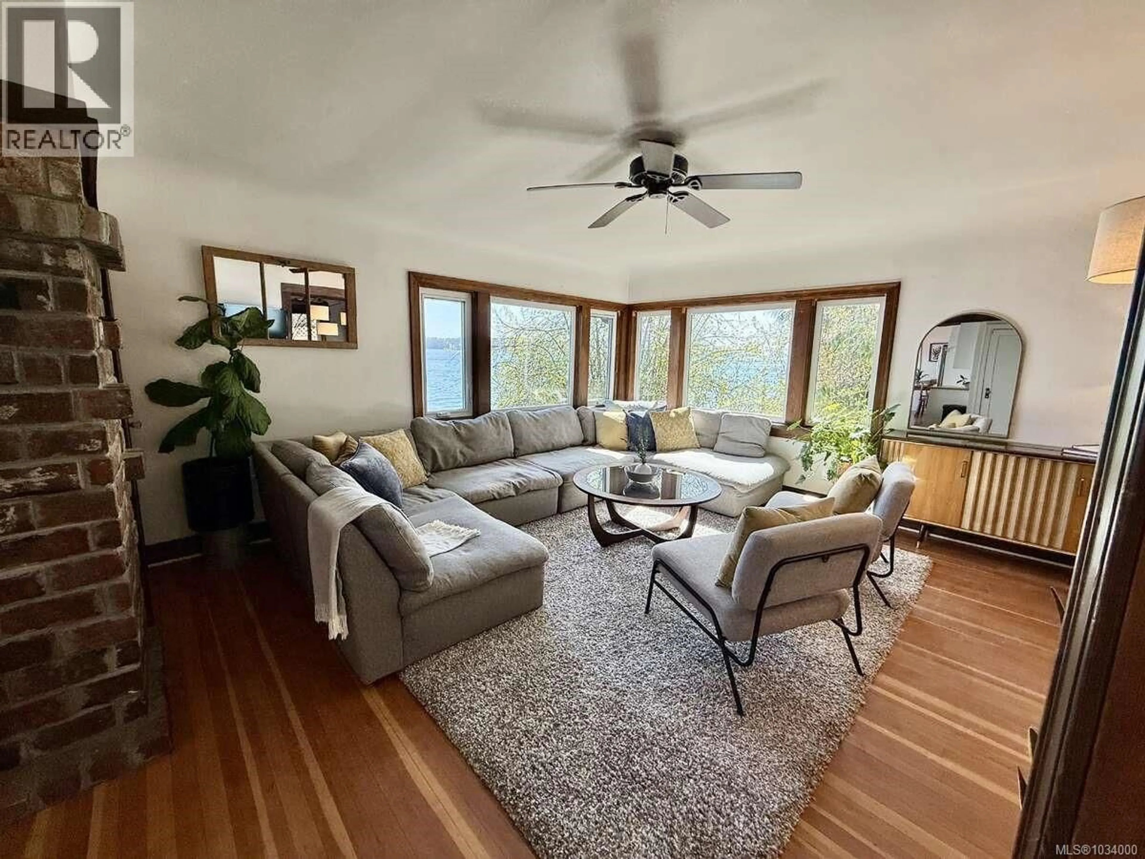 Living room with furniture, unknown for 5696 ISLAND HIGHWAY SOUTH, Union Bay British Columbia V0R3B0