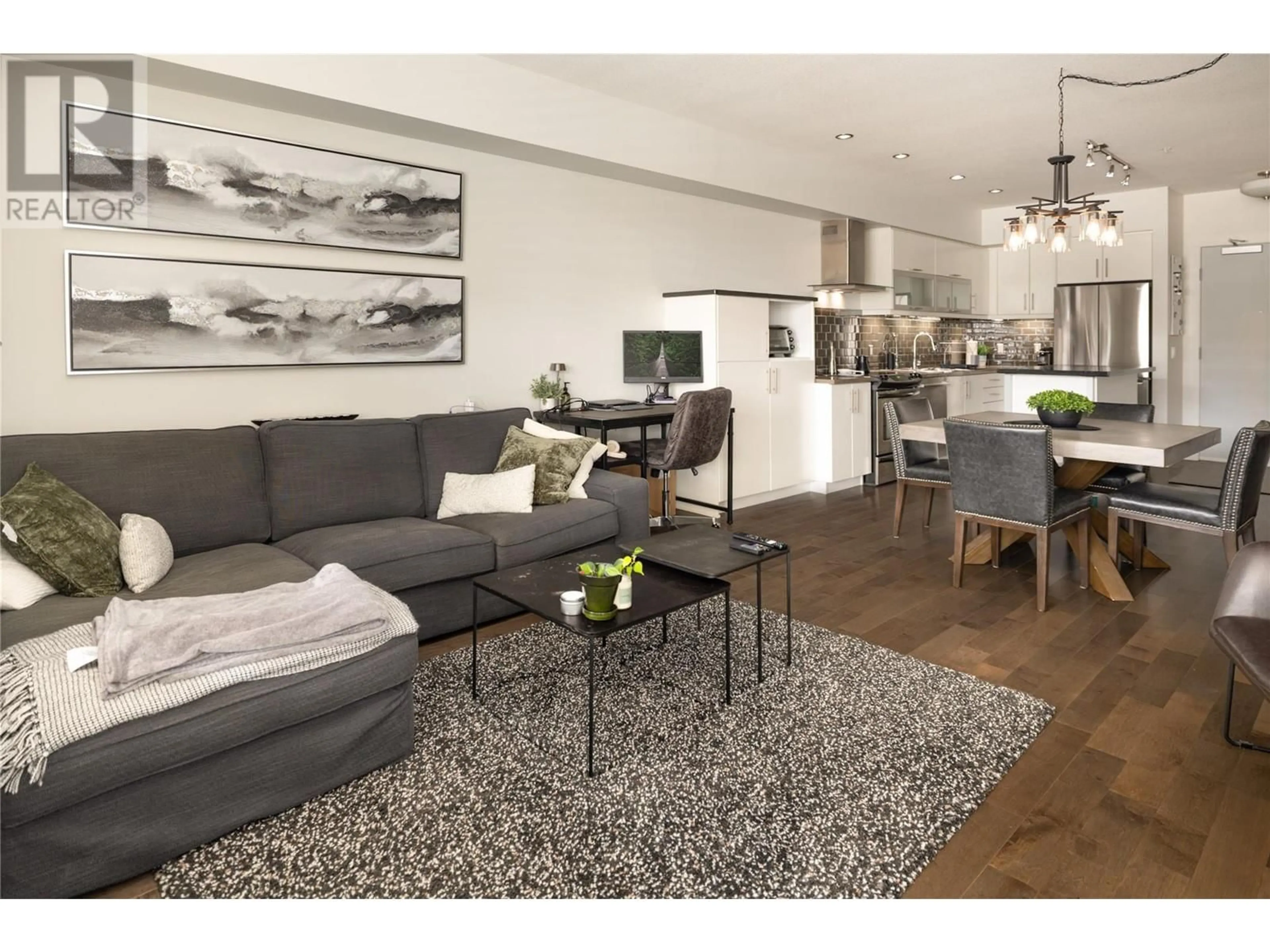Living room with furniture, wood/laminate floor for 207 - 700 MARTIN AVENUE, Kelowna British Columbia V1Y6V4